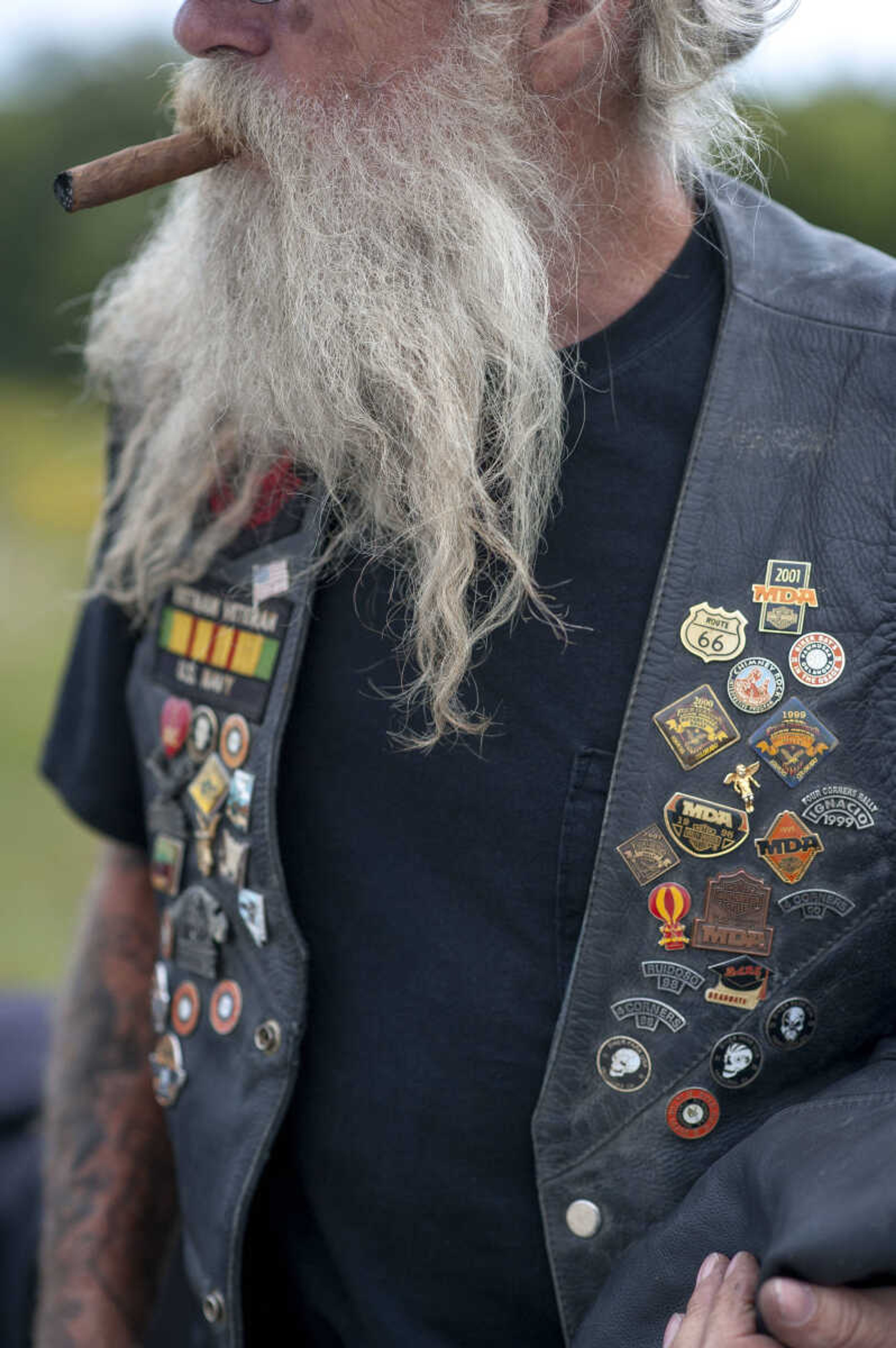 Harold Mabary smokes a cigar after arriving at the first-ever Missouri Vietnam Wall Run Saturday, Sept. 21, 2019, at the Missouri's National Veterans Memorial in Perryville.