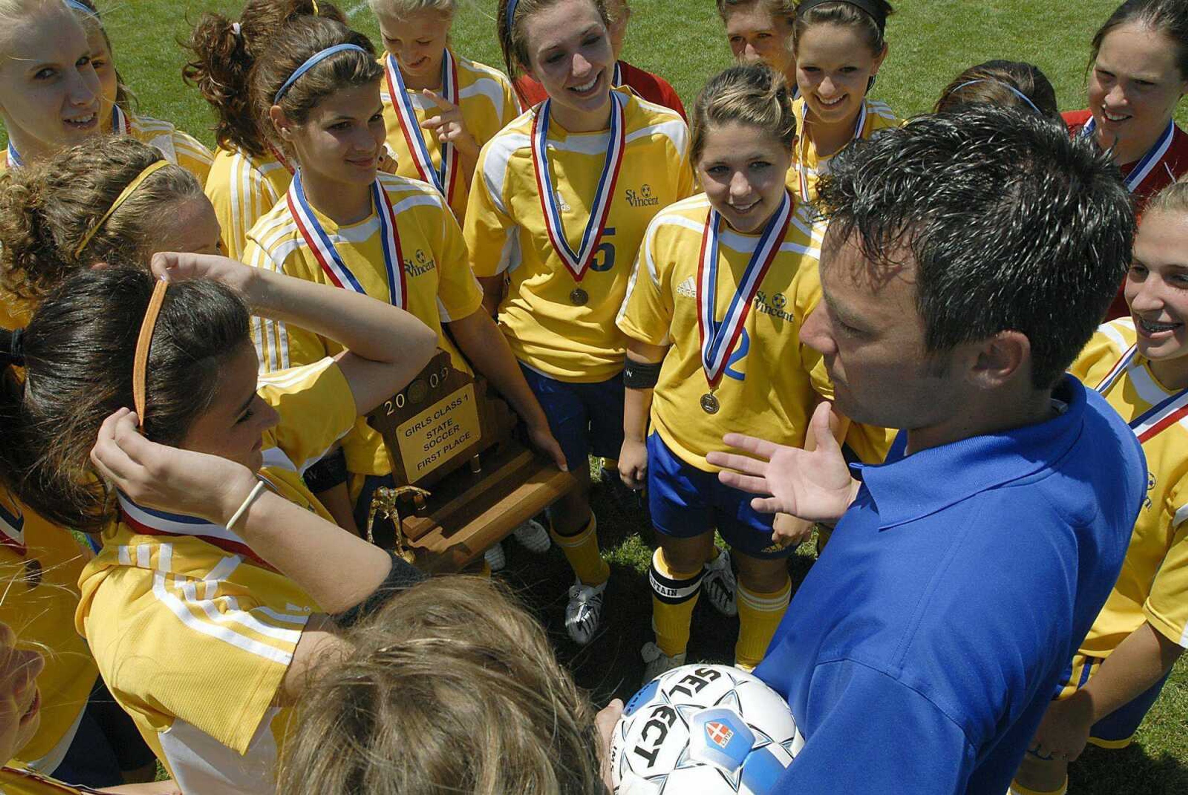 St. Vincent coach Dustin Wengert talks to his team after the Indians defeated Trinity in last season's Class 1 championship game. St. Vincent returns all but three players from its title team. (Southeast Missourian file)