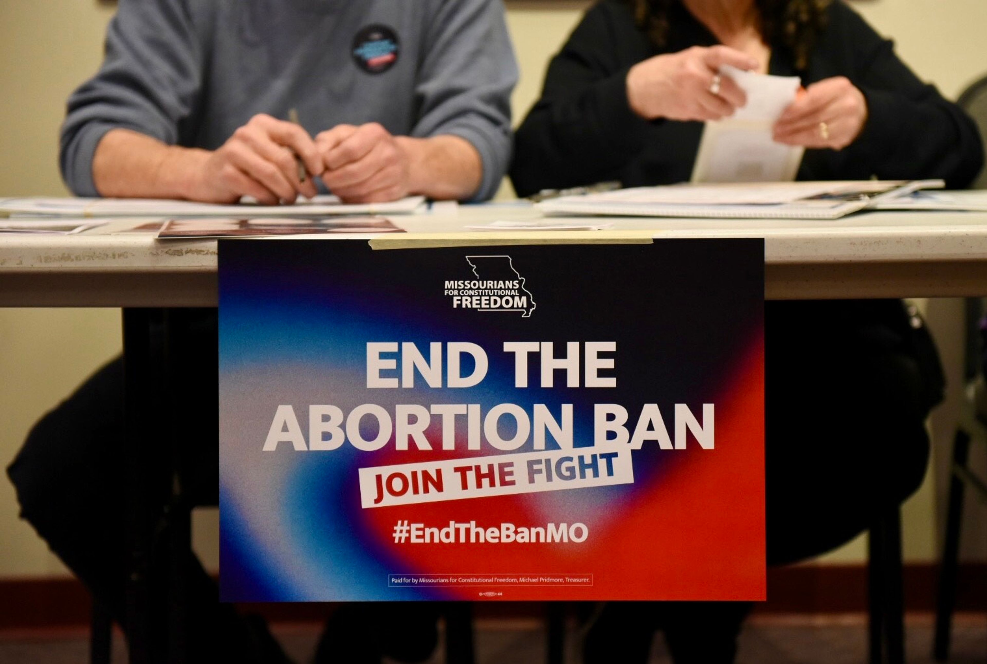 Volunteers with Missourians for Constitutional Freedom collect signatures in support of an amendment to legalize abortion up to the point of fetal viability in Missouri on Feb. 6 in Kansas City.