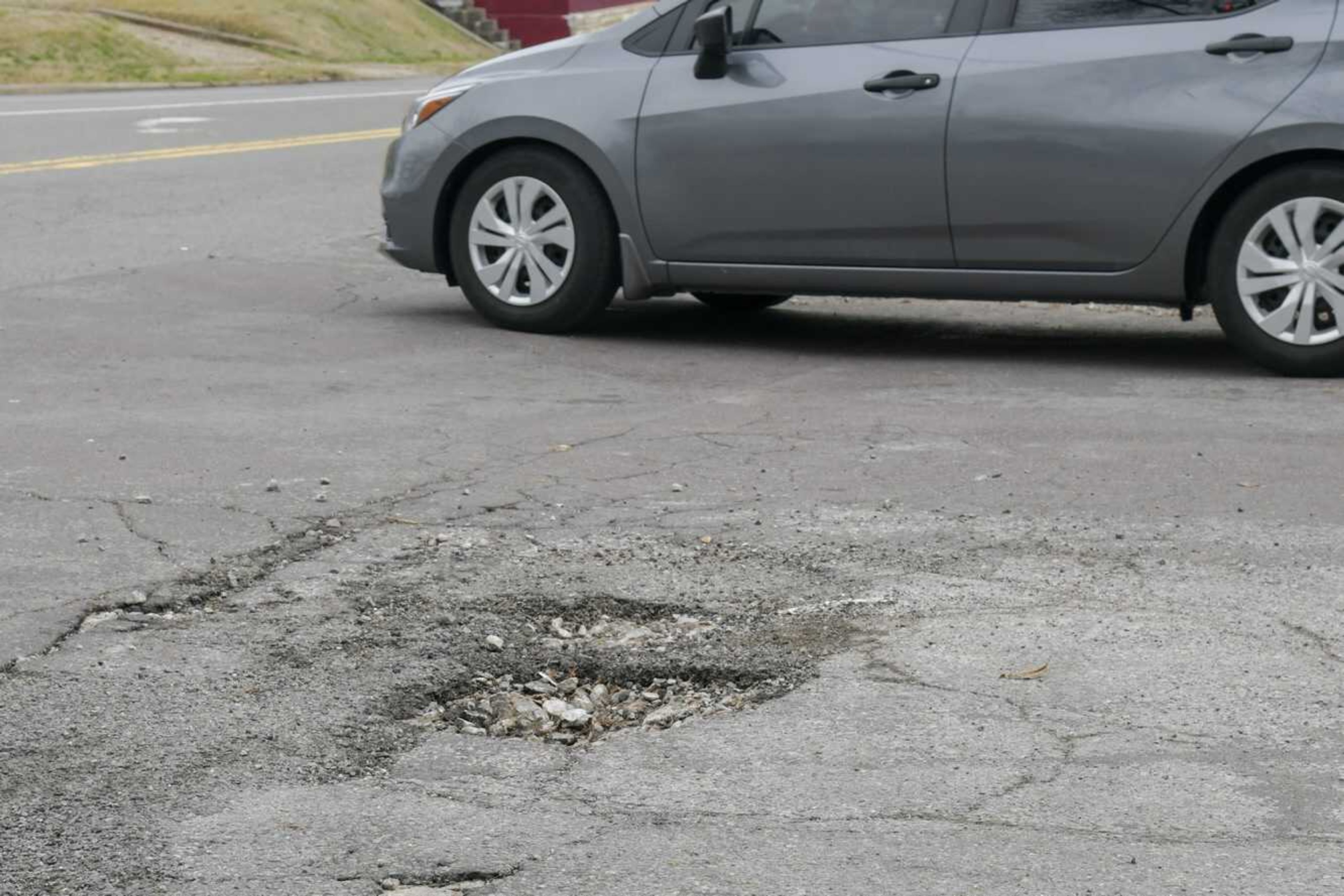 A pot hole is seen Monday at the intersection of North Sprigg and Bellevue streets in Cape Girardeau.