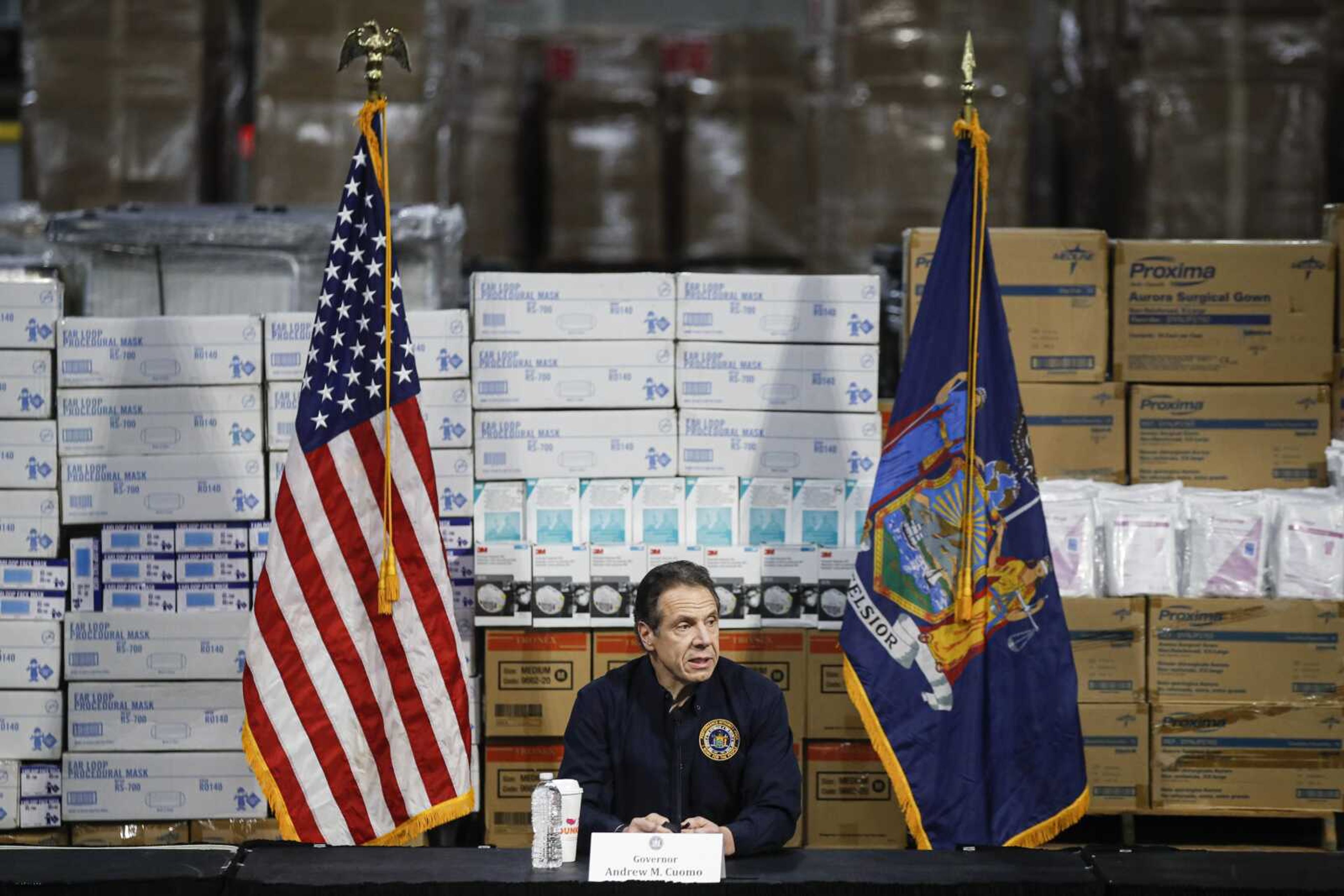 Gov. Andrew Cuomo speaks during a news conference Tuesday against a backdrop of medical supplies at the Jacob Javits Center that will house a temporary hospital in response to the COVID-19 outbreak in New York.