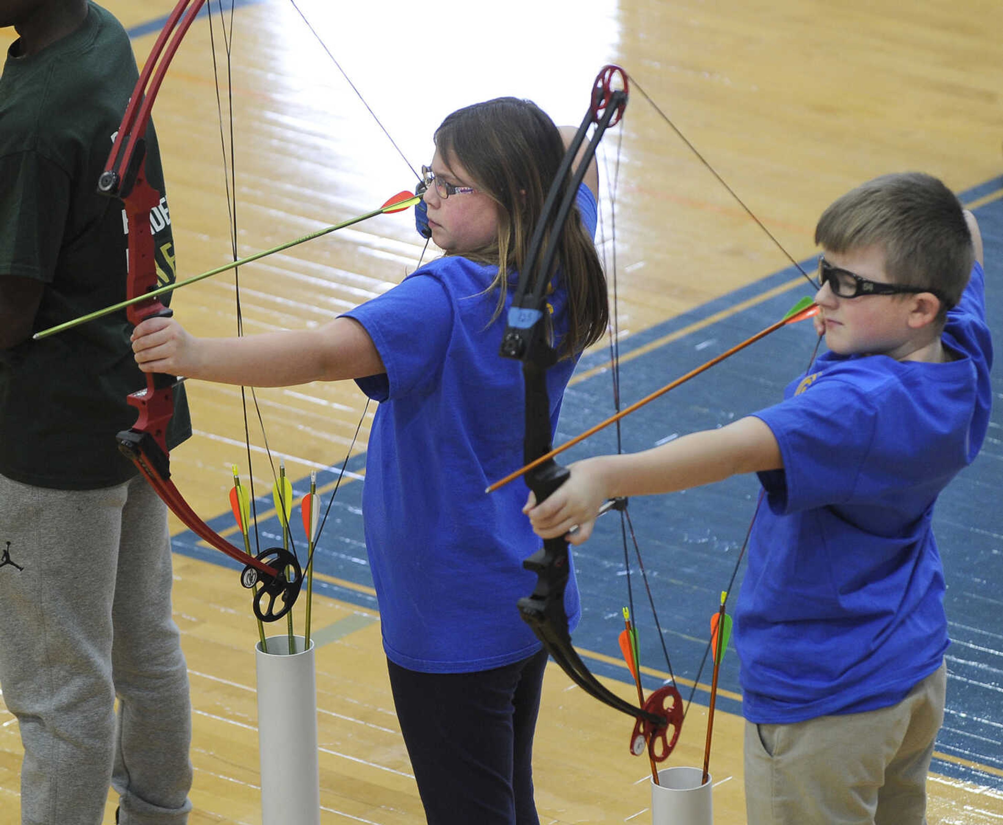 FRED LYNCH ~ flynch@semissourian.com
Abby Burton and Mikey McClard, students at St. Ambrose School in Chaffee, Missouri, draw their bows Saturday, Feb. 3, 2018 during a National Archery in the Schools Program tournament at Immaculate Conception Catholic School in Jackson.