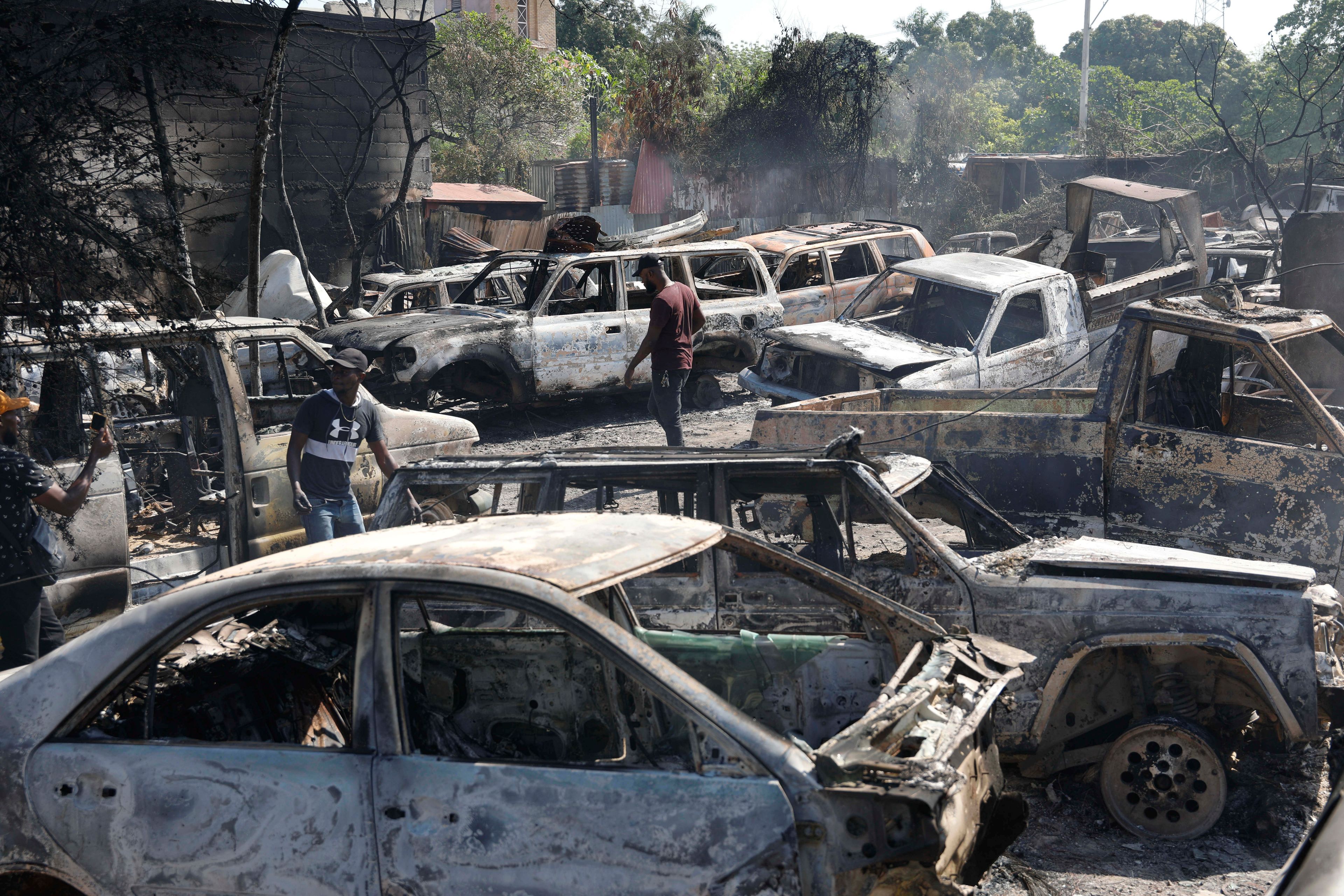 FILE - Gangs control the streets of Haiti’s capital, clashing in street violence that leaves burned cars as sources of parts at a mechanic's shop where people scavenged in the capital, Port-au-Prince, on March 25, 2024. (AP Photo/Odelyn Joseph, File)