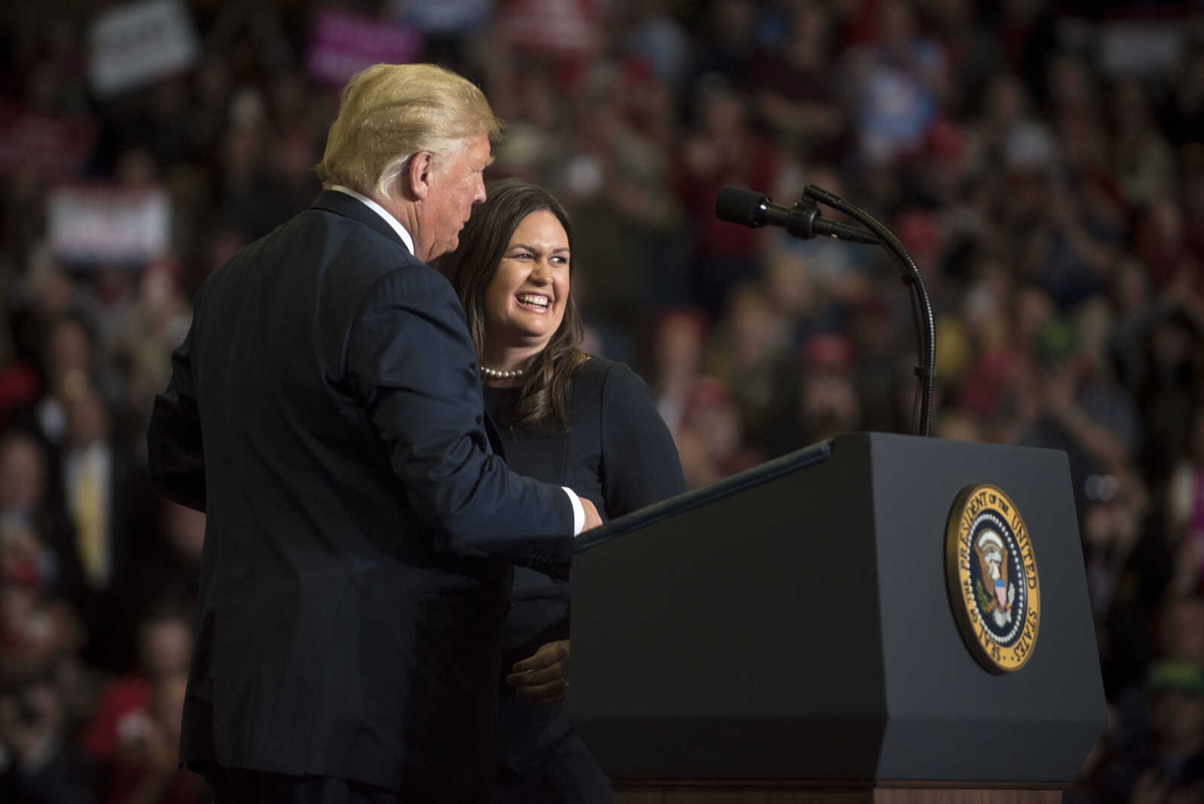 President Donald Trump welcomes White House press secretary Sarah Huckabee Sanders to the podium during a Make America Great Again rally Monday, Nov. 5, 2018, at the Show Me Center in Cape Girardeau.