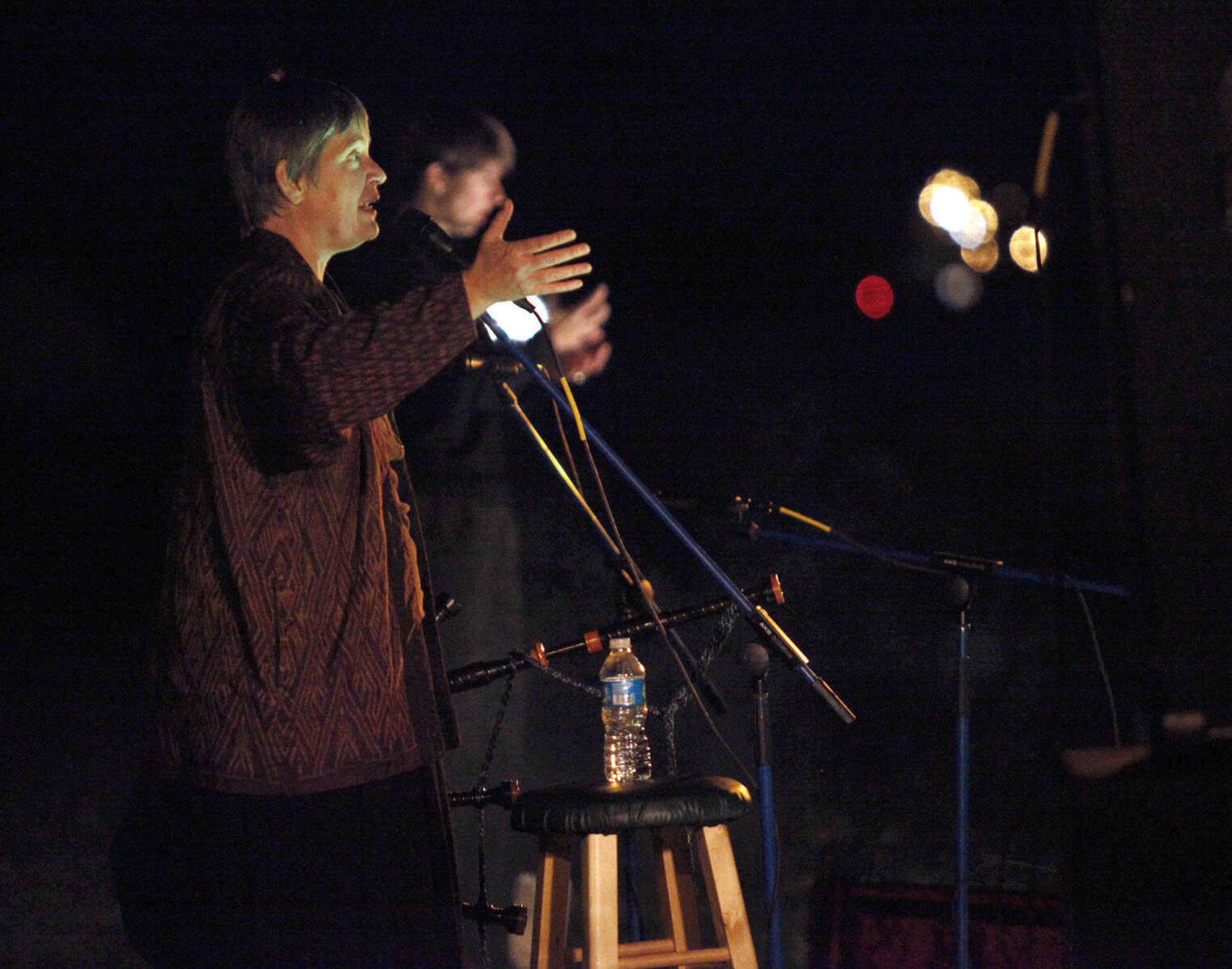 CHRIS MACKLER ~ photos@semissourian.com

Storyteller Jennifer Armstrong tells a spooky tale during the Ghost Storytelling Festival held near the Old Beech Tree on the east lawn of Southeast Missouri State University's River Campus in Cape Girardeau on Friday, Oct. 15, 2010. According to Chuck Martin, Executive Director of the Cape Girardeau Convention and Visitors Bureau, around 650 people attended the event.