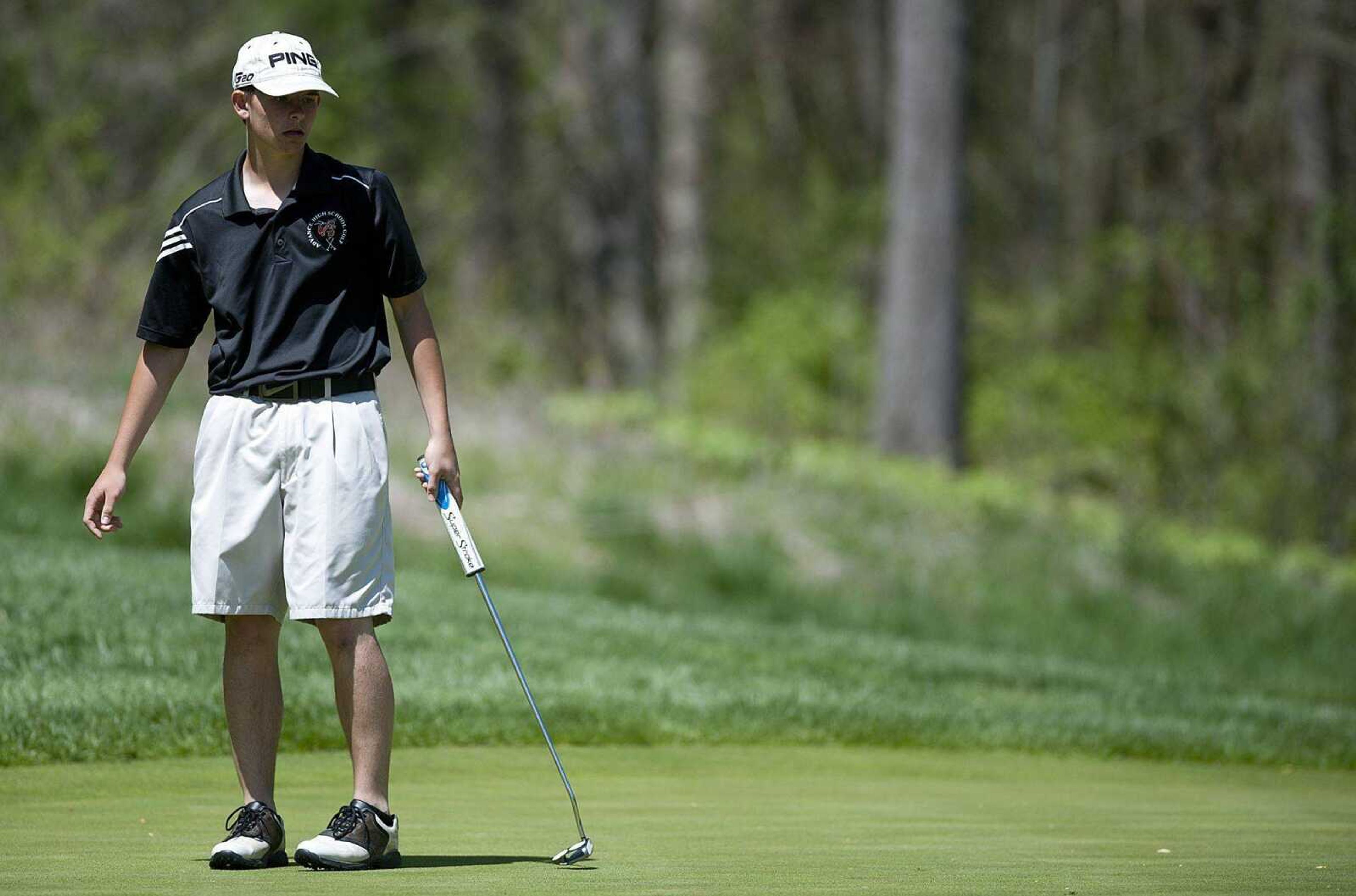 Advance&#8217;s Brian Whitson watches his putt on the 16th green during the SEMO Conference tournament Tuesday at Dalhousie Golf Club. Whitson placed first in the small-school division with a 2-over 74. (Adam Vogler)