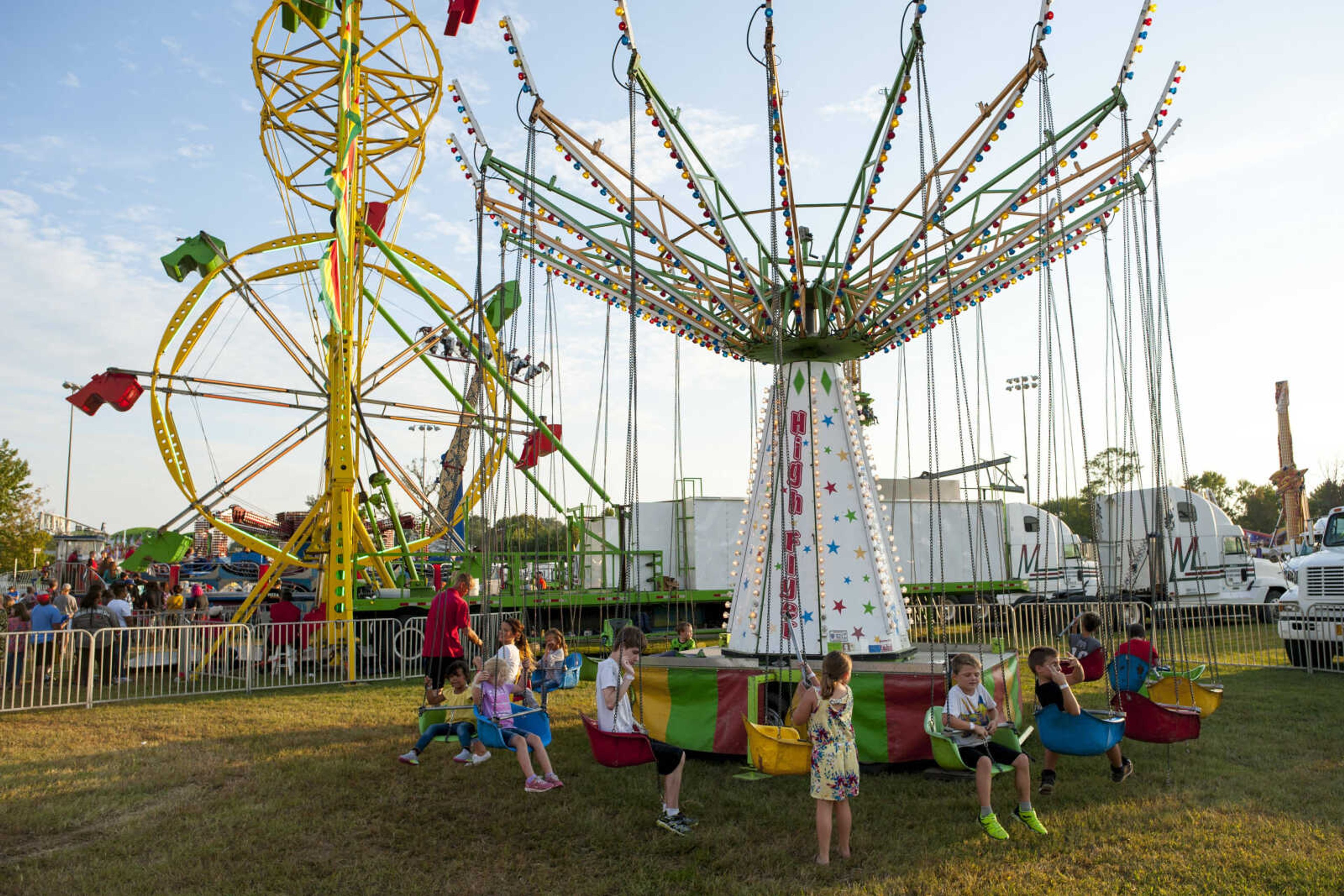 Children fill seats on the "High Rider" attraction in the midway Tuesday, Sept. 10, 2019, during the SEMO District Fair at Arena Park in Cape Girardeau.