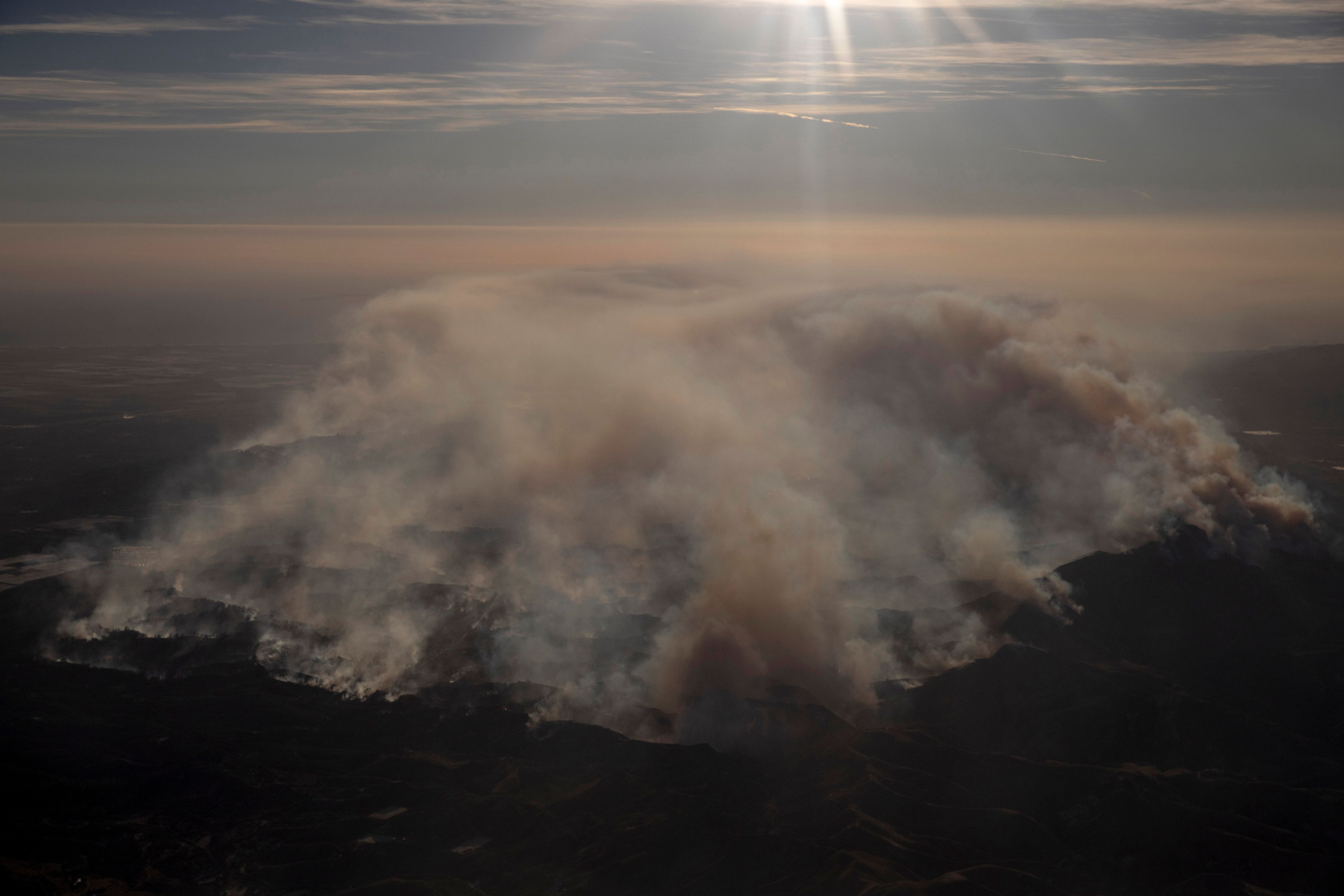 Smoke rises from the Mountain Fire as seen from a commercial flight near Ventura County, California, Wednesday Nov. 6, 2024. (Stephen Lam/San Francisco Chronicle via AP)