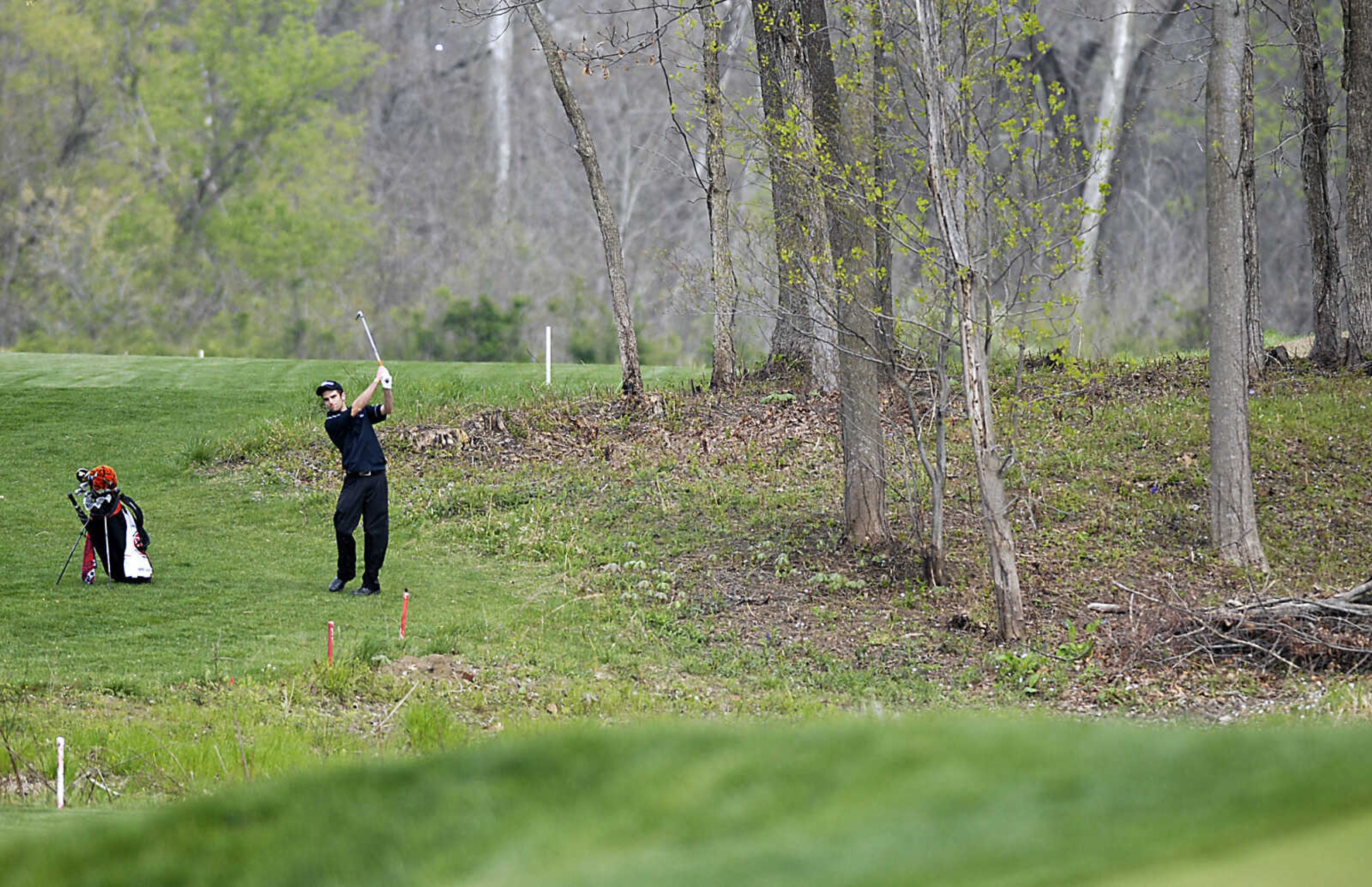 KIT DOYLE ~ kdoyle@semissourian.com
Central's Jordan Sheets watches his iron shot on the first hole Thursday, April 16, 2009, during the Saxony Lutheran Invitational at Dalhousie Golf Club in Cape Girardeau.