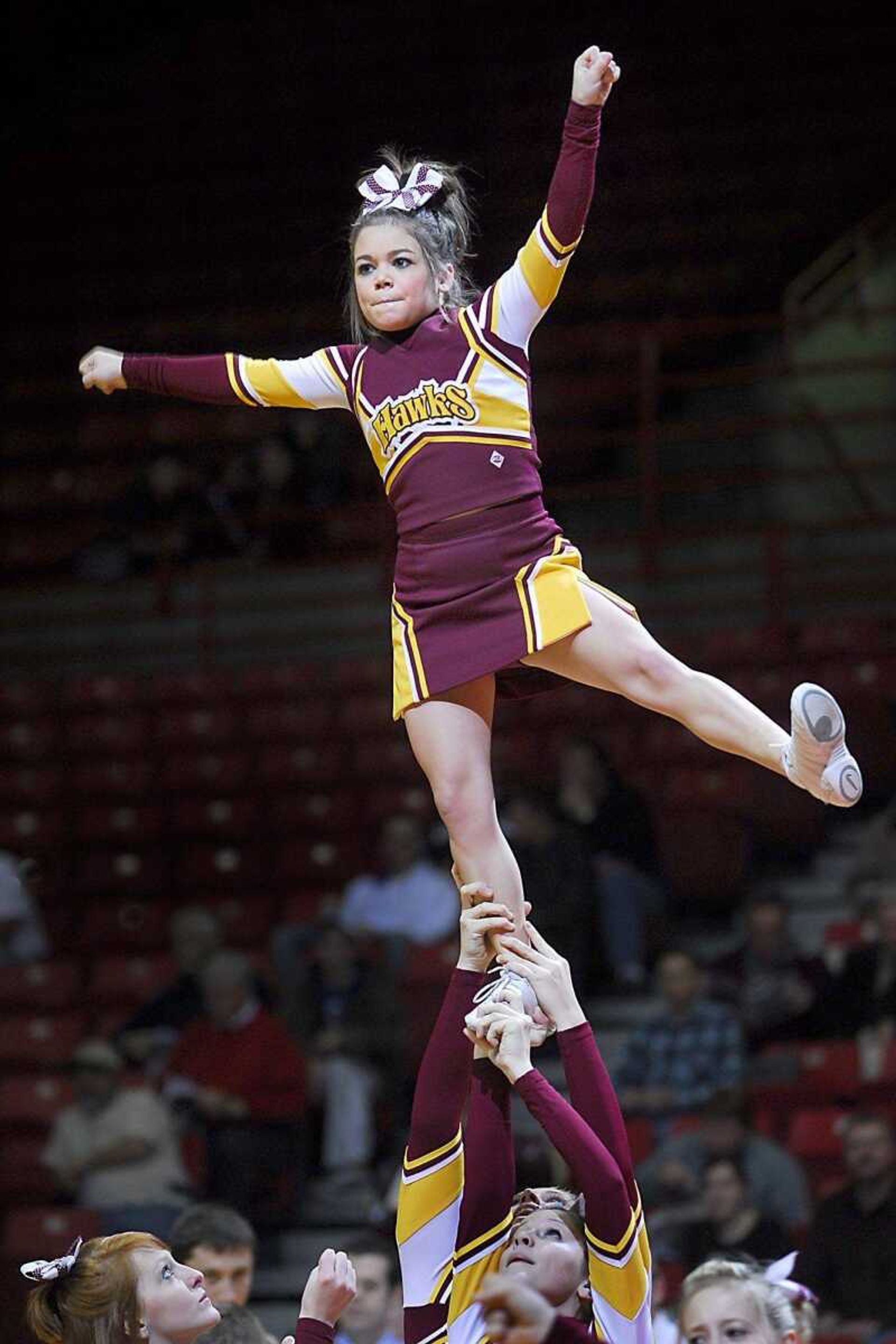 Paige Rampley performed with the Kelly Hawks cheerleaders Thursday at the Southeast Missourian Christmas Tournament. (Fred Lynch)