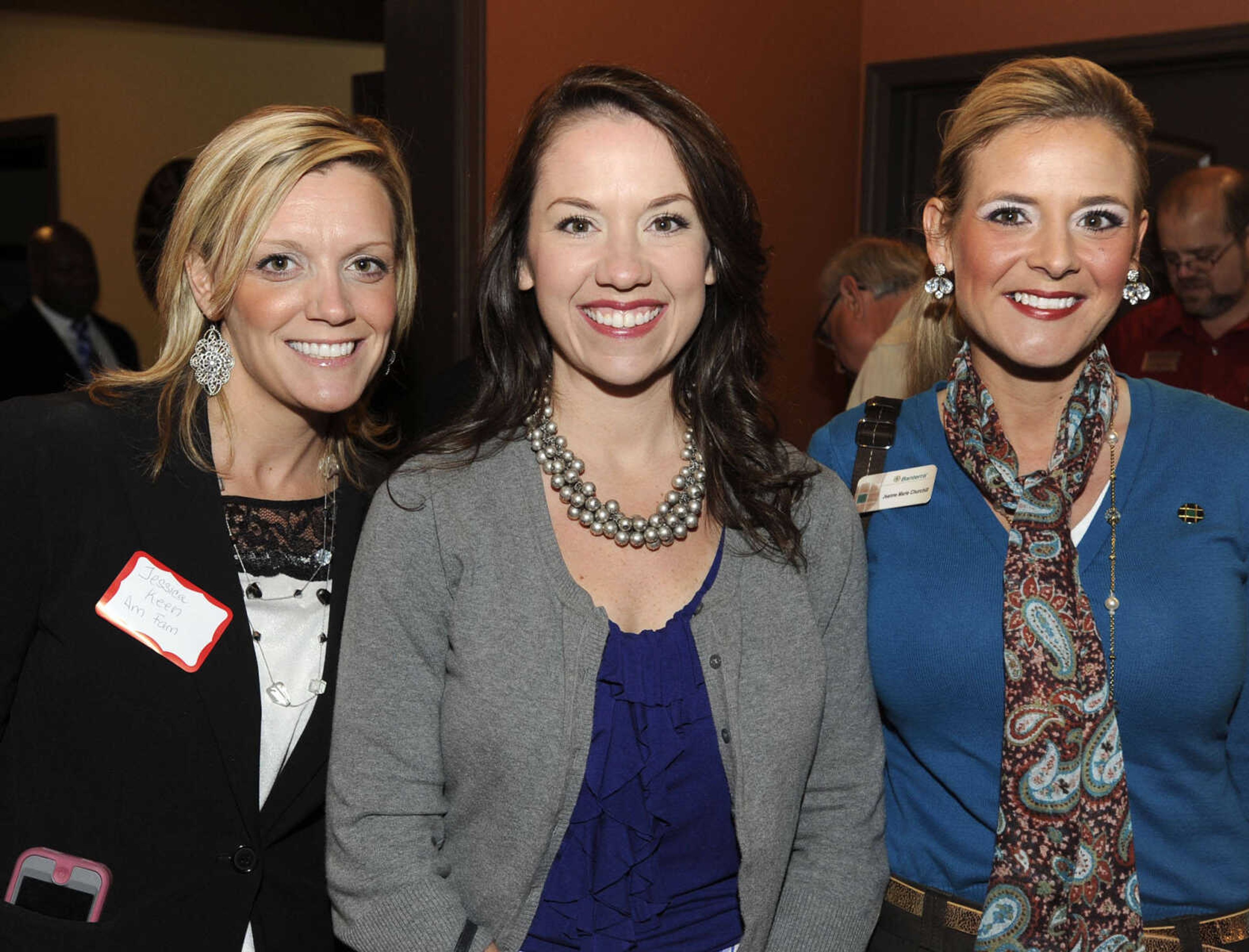 Jessica Keen, left, with American Family Insurance, Teresa Haney with United Land Title, and Jeanne Churchill with Banterra Bank.