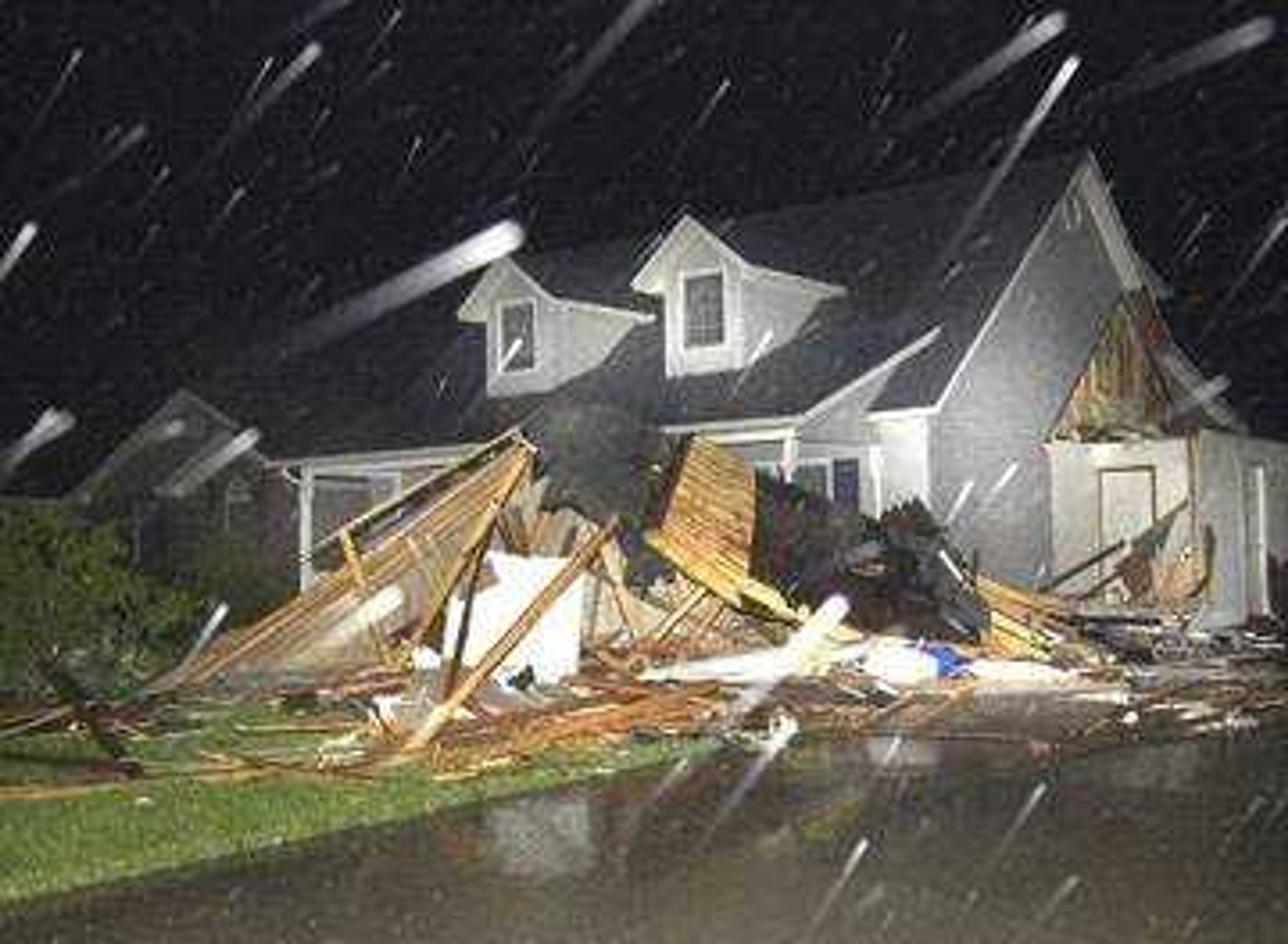 What once was an attached garage at the residence located at 1855 Ridge Rd. in Jackson  is now a large pile of splintered wood after Tuesday's, May 6, 2003, tornado.