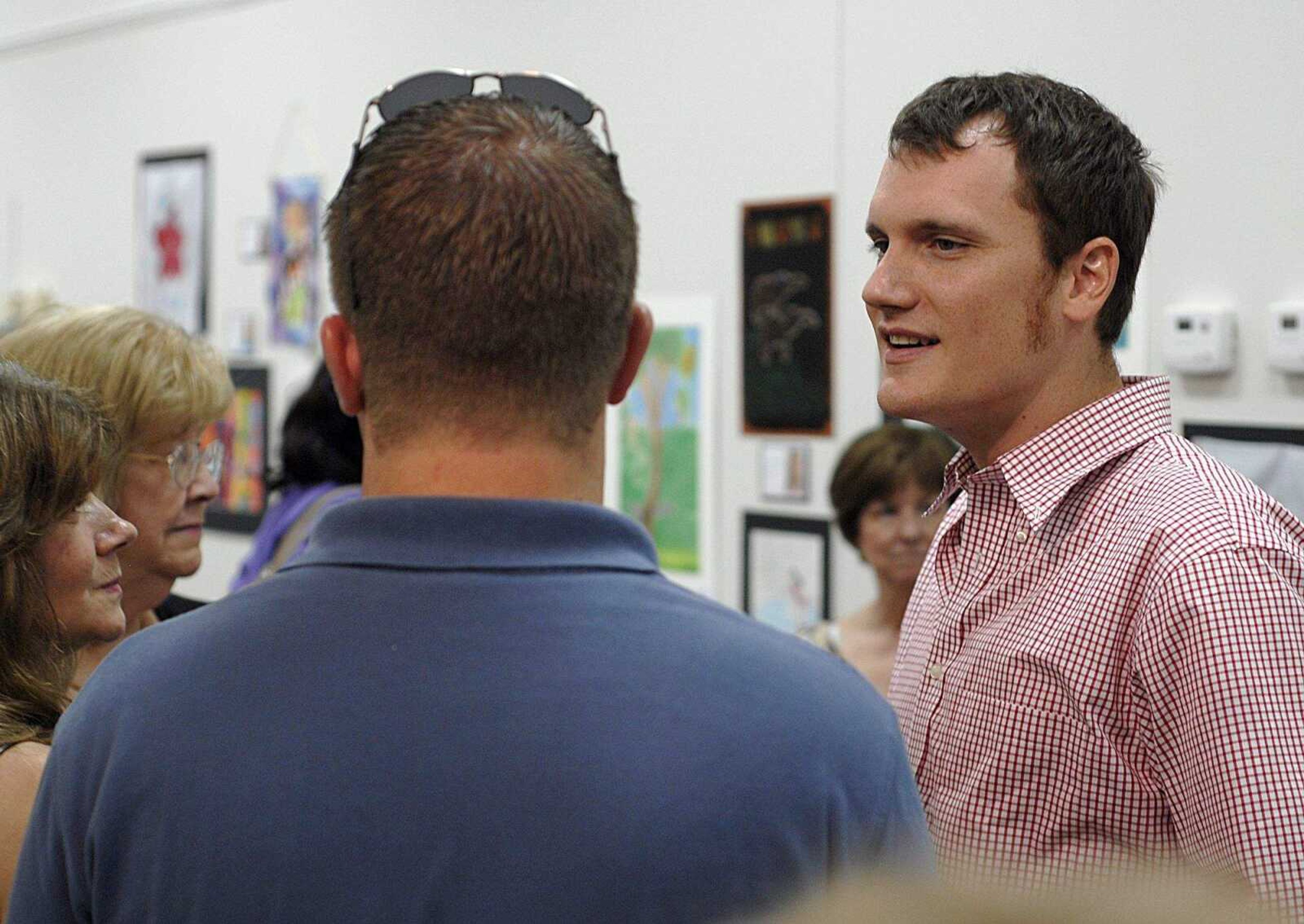 AARON EISENHAUER ~ aeisenhauer@semissourian.com
Artist Jake L. Wells talks with guests of the exhibit.