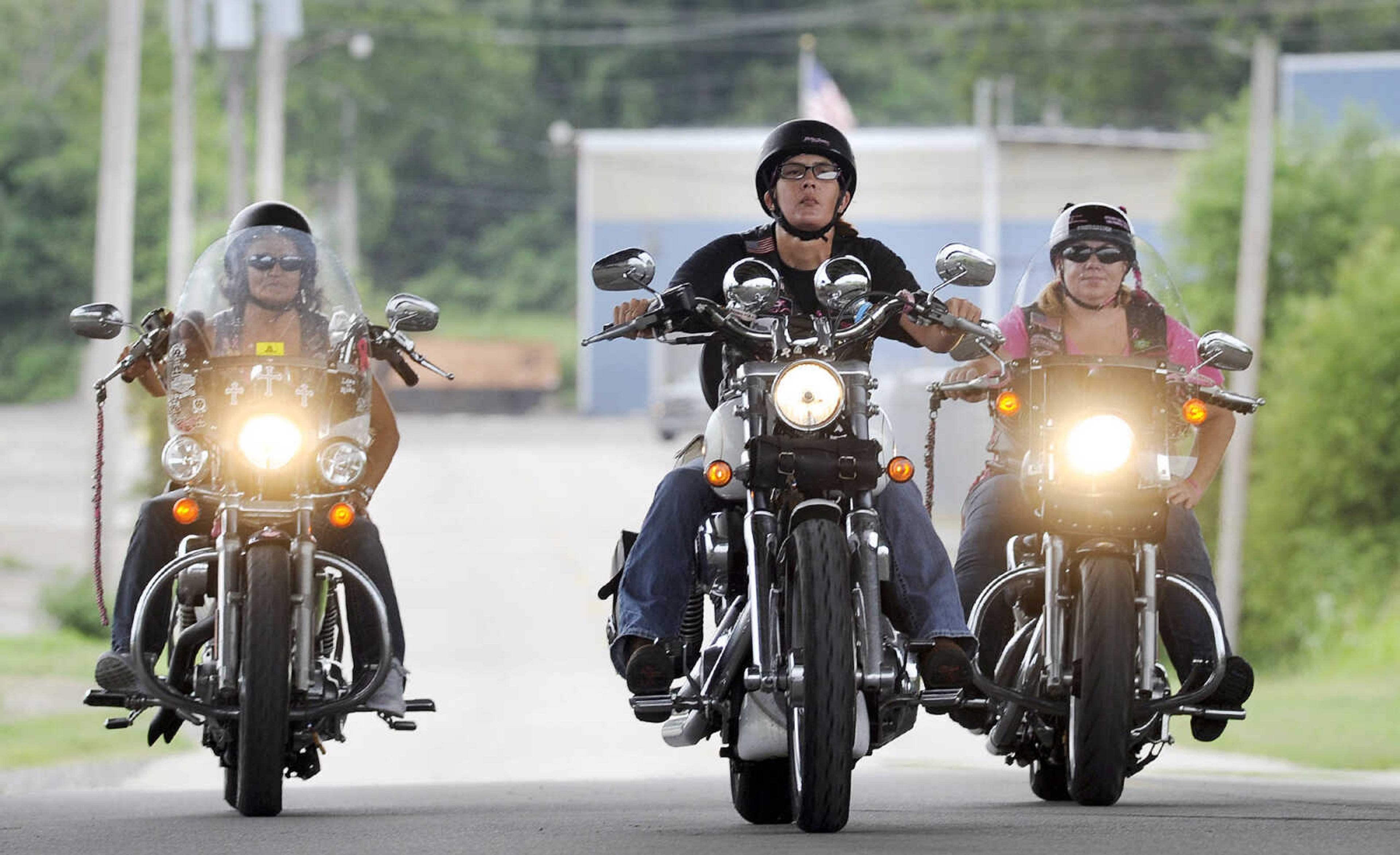 LAURA SIMON ~ lsimon@semissourian.com

The Chrome Queens cruise down Aquamsi Street in Cape Girardeau on Thursday, Aug. 18, 2016.