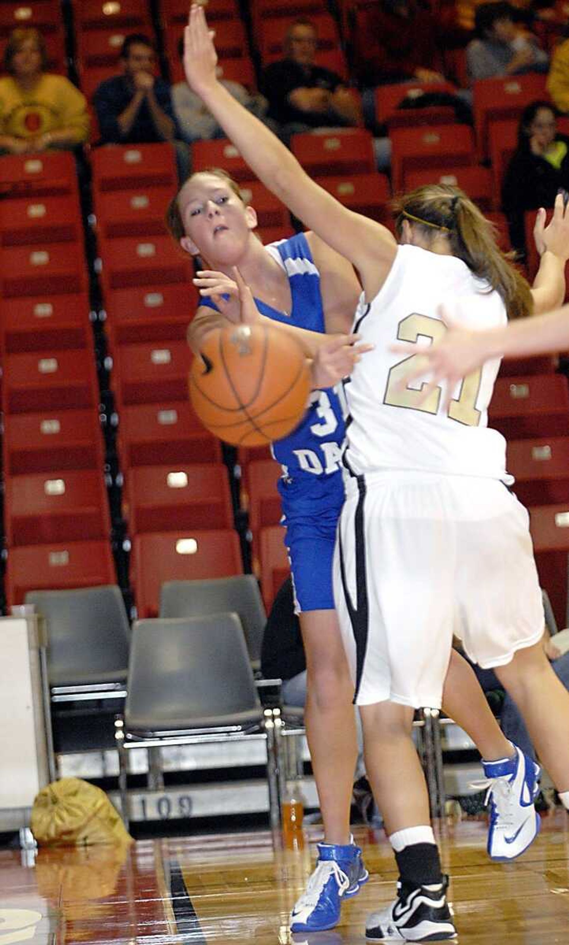 Notre Dame's Meghan Dohogne passsed along the baseline around went Farmington defender Ashley Jenson in the St. Francis Medical Center Holiday Classic championship game Friday night, December 21, 2007, at the Show Me Center. (Kit Doyle)