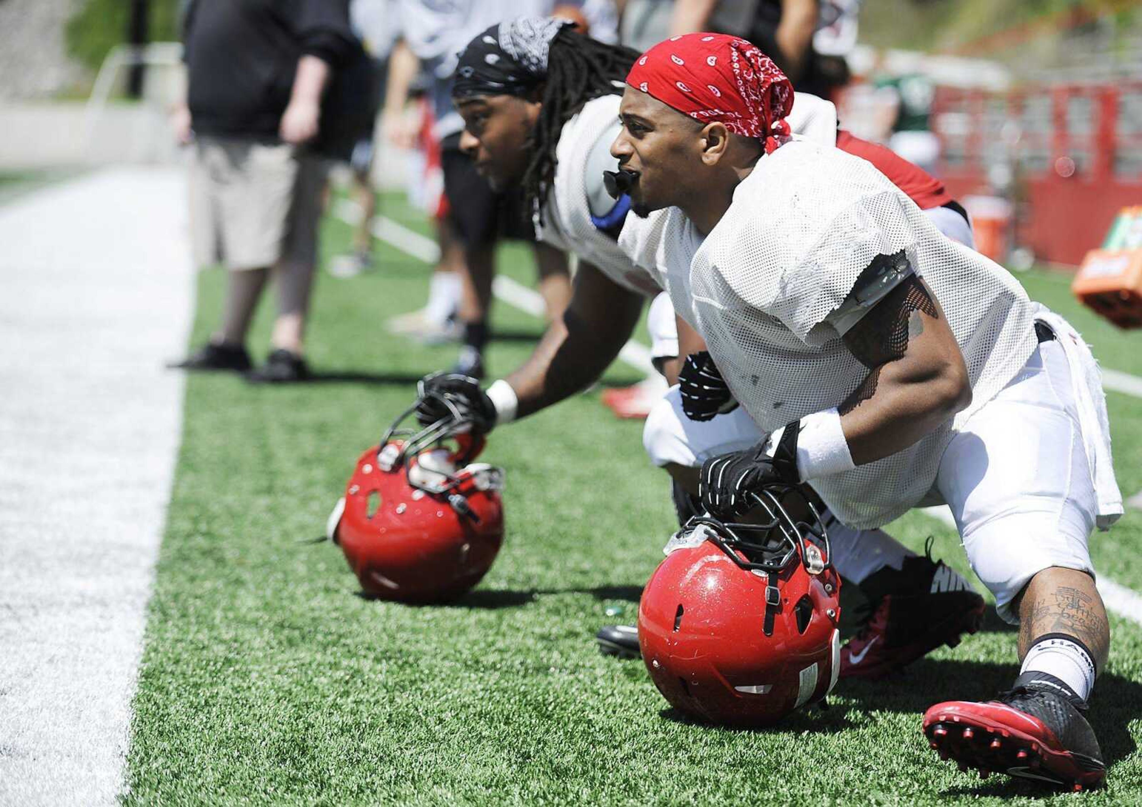 Southeast Missouri State tailback Lennies McFerren, right, and fullback Ron Coleman stretch before a scrimmage Saturday at Houck Stadium. (ADAM VOGLER)