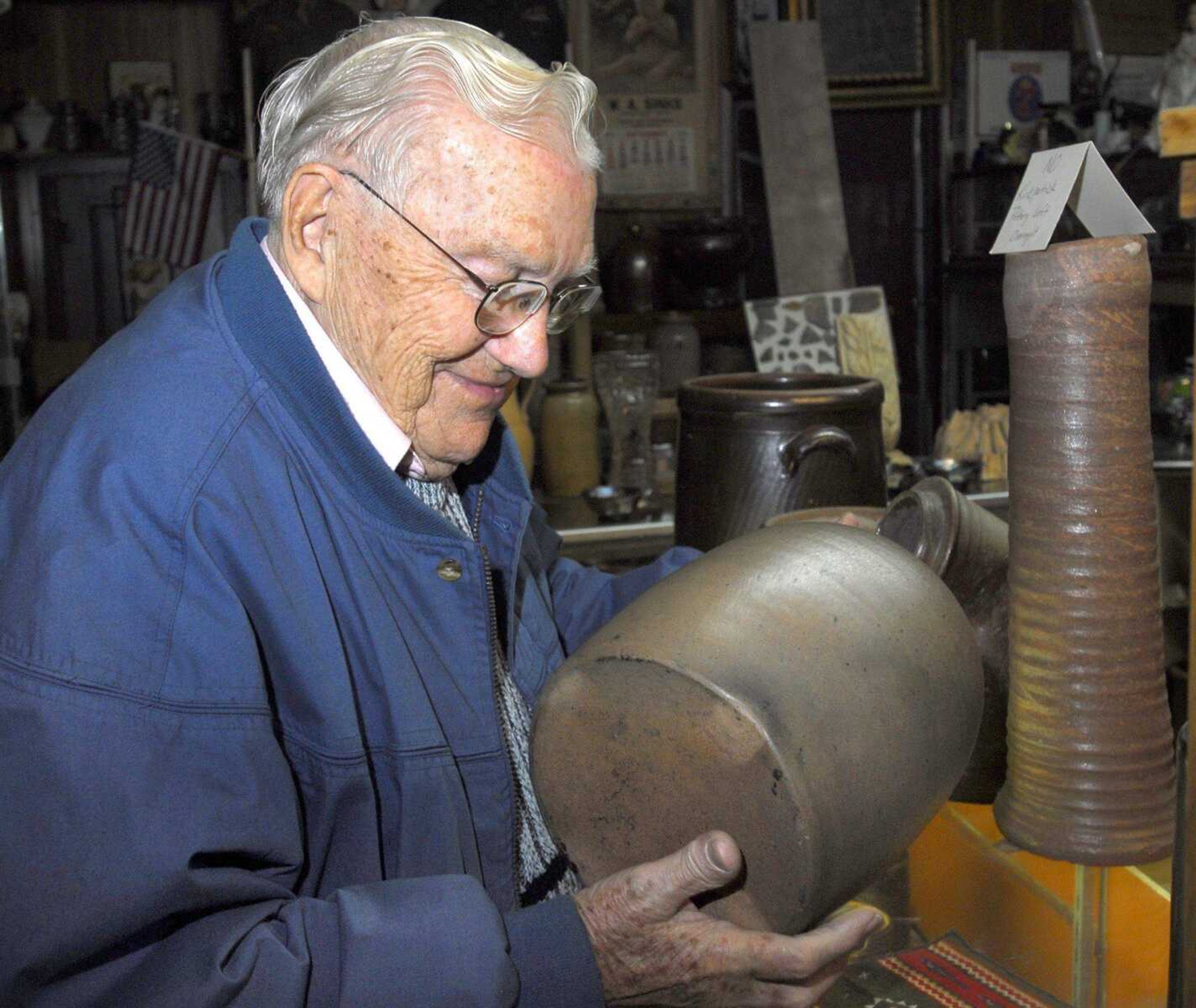 Tunney Isom keeps track of the Anna Pottery items in the Anna Kirkpatrick Pottery Museum. (Fred Lynch)