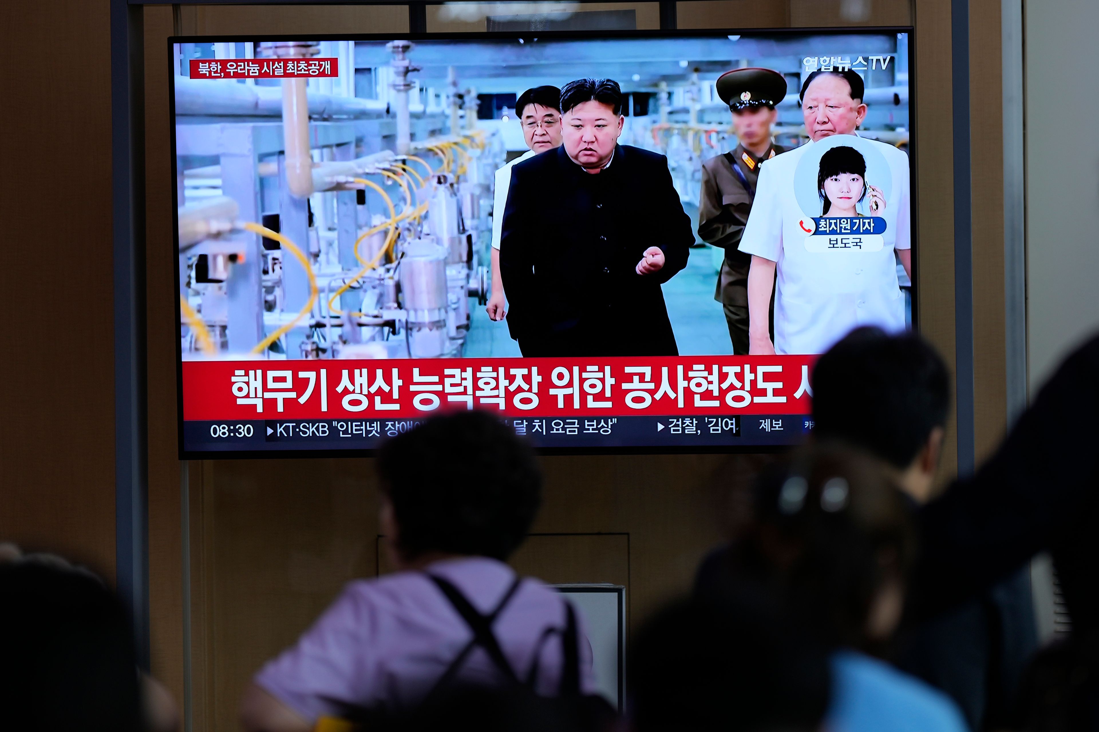 A TV screen shows an image of North Korean leader Kim Jong Un during a news program at the Seoul Railway Station in Seoul, South Korea, Friday, Sept. 13, 2024. The letters read, "North Korea, unveiling the uranium enrichment facility for the first time," and "the construction site for expanding the capacity for the production of nuclear weapons." (AP Photo/Lee Jin-man)