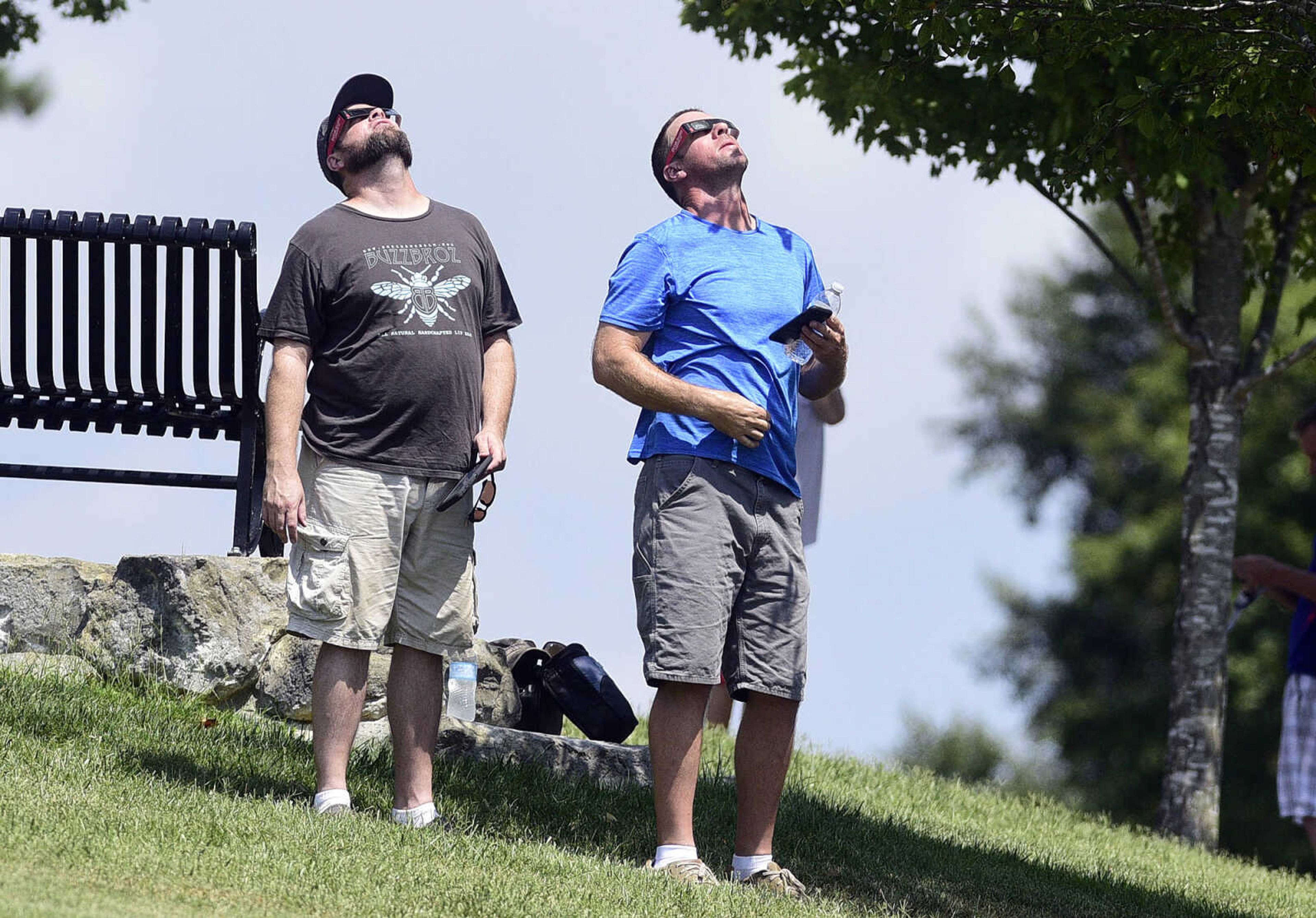 Visitors watch the stages of the solar eclipse on Monday, Aug. 21, 2017, from the River Campus in Cape Girardeau.