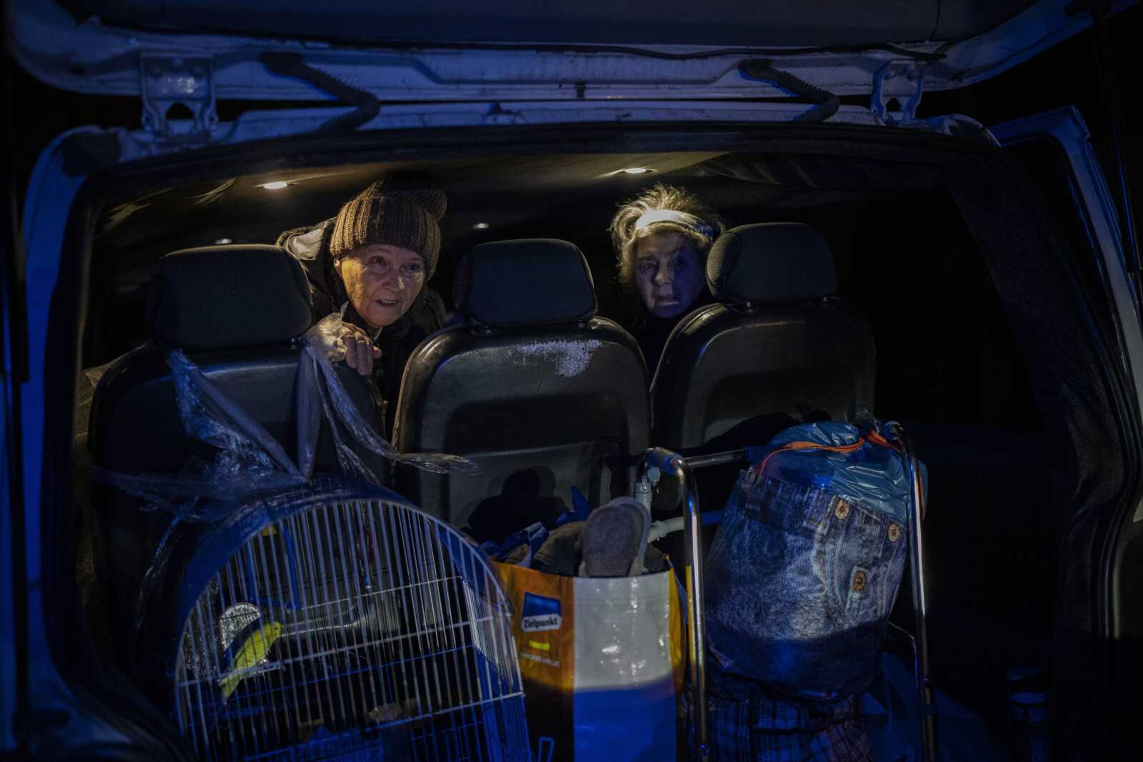 Elderly residents are evacuated by a local organization Sunday, Nov. 27, from the southern city of Kherson, Ukraine. Shelling by Russian forces struck several areas in eastern and southern Ukraine overnight as utility crews continued a scramble to restore power, water and heating following widespread strikes in recent weeks, officials said Sunday.