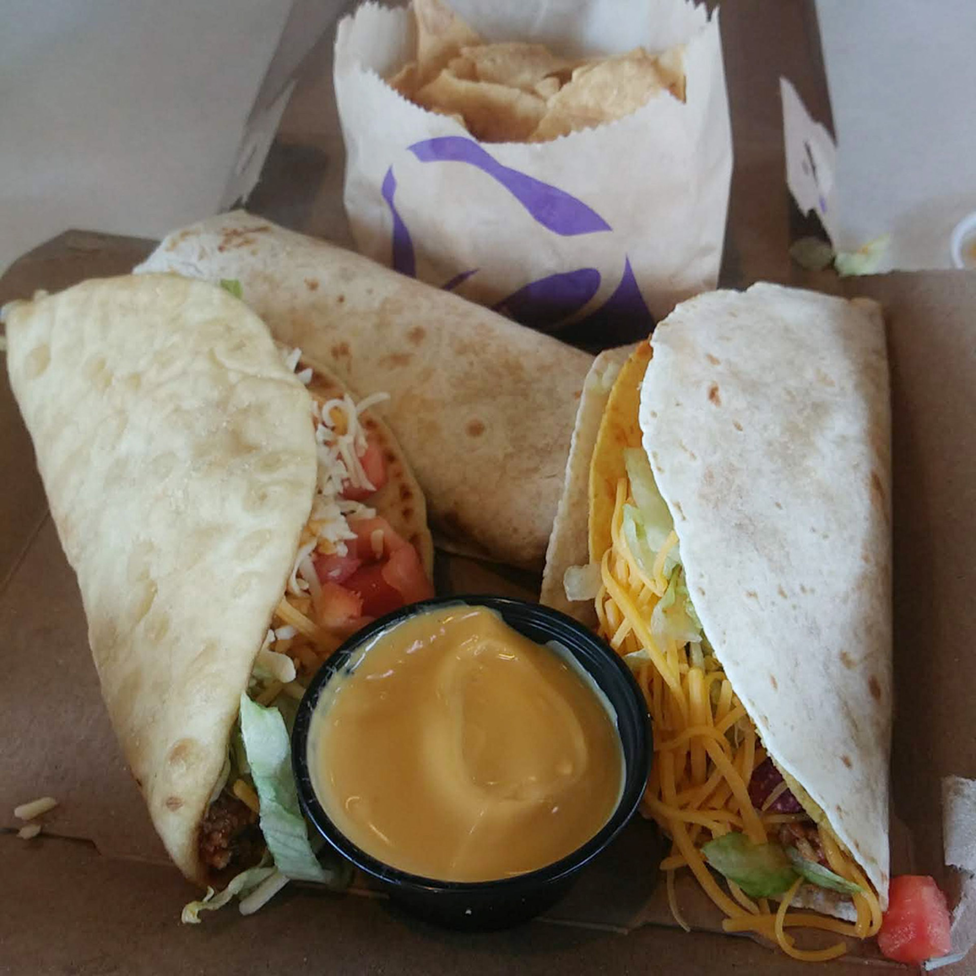 Taco Bell's Lux Cravings Box. A huge amount of food that also comes with a drink.