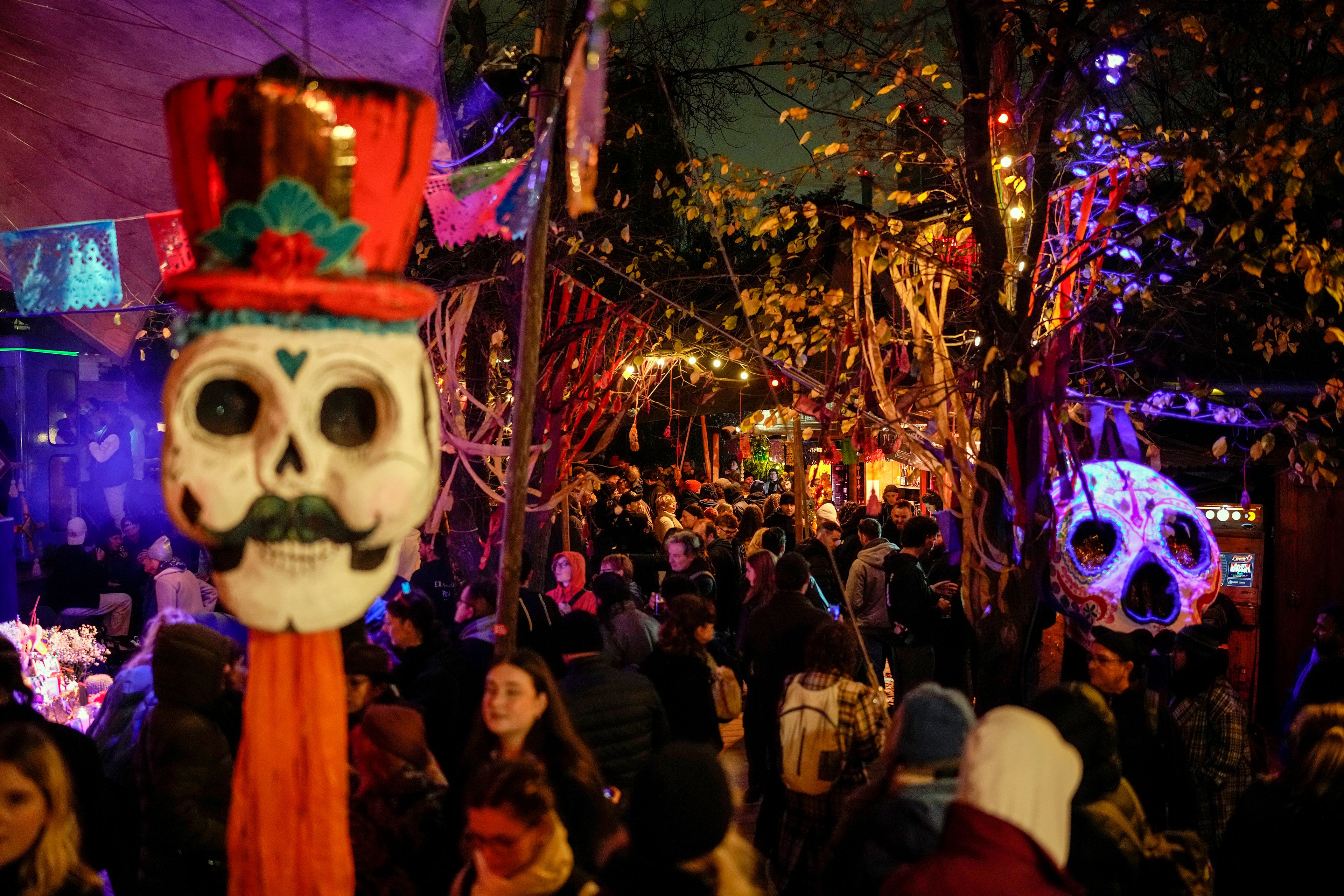 People attend a ceremony of the Day of the Dead in Berlin, Friday, Nov. 1, 2024. (AP Photo/Ebrahim Noroozi)