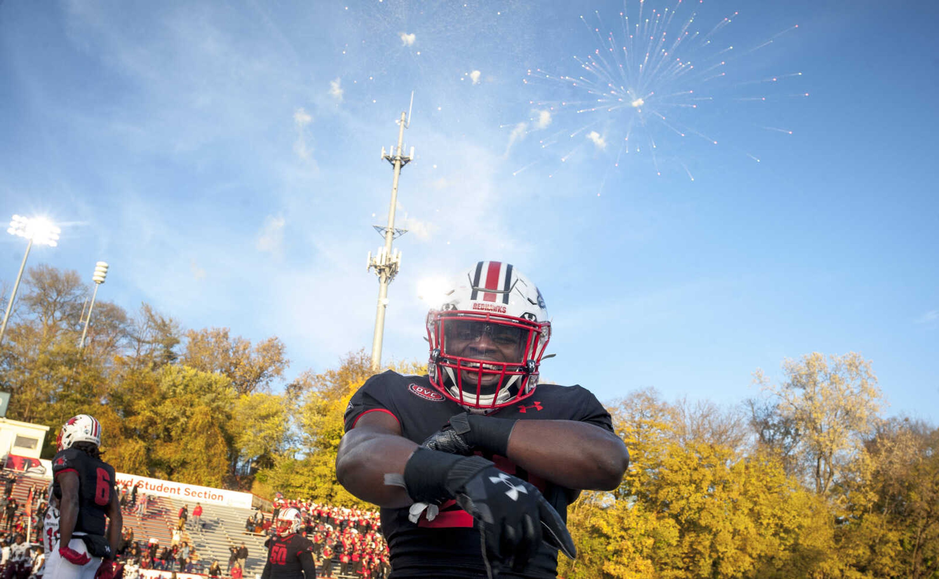 Southeast's Mark Robinson (23) celebrates on the field as fireworks explode over Houck Stadium after the Redhawks' comeback win over Eastern Kentucky University Saturday, Nov. 9, 2019, in Cape Girardeau.