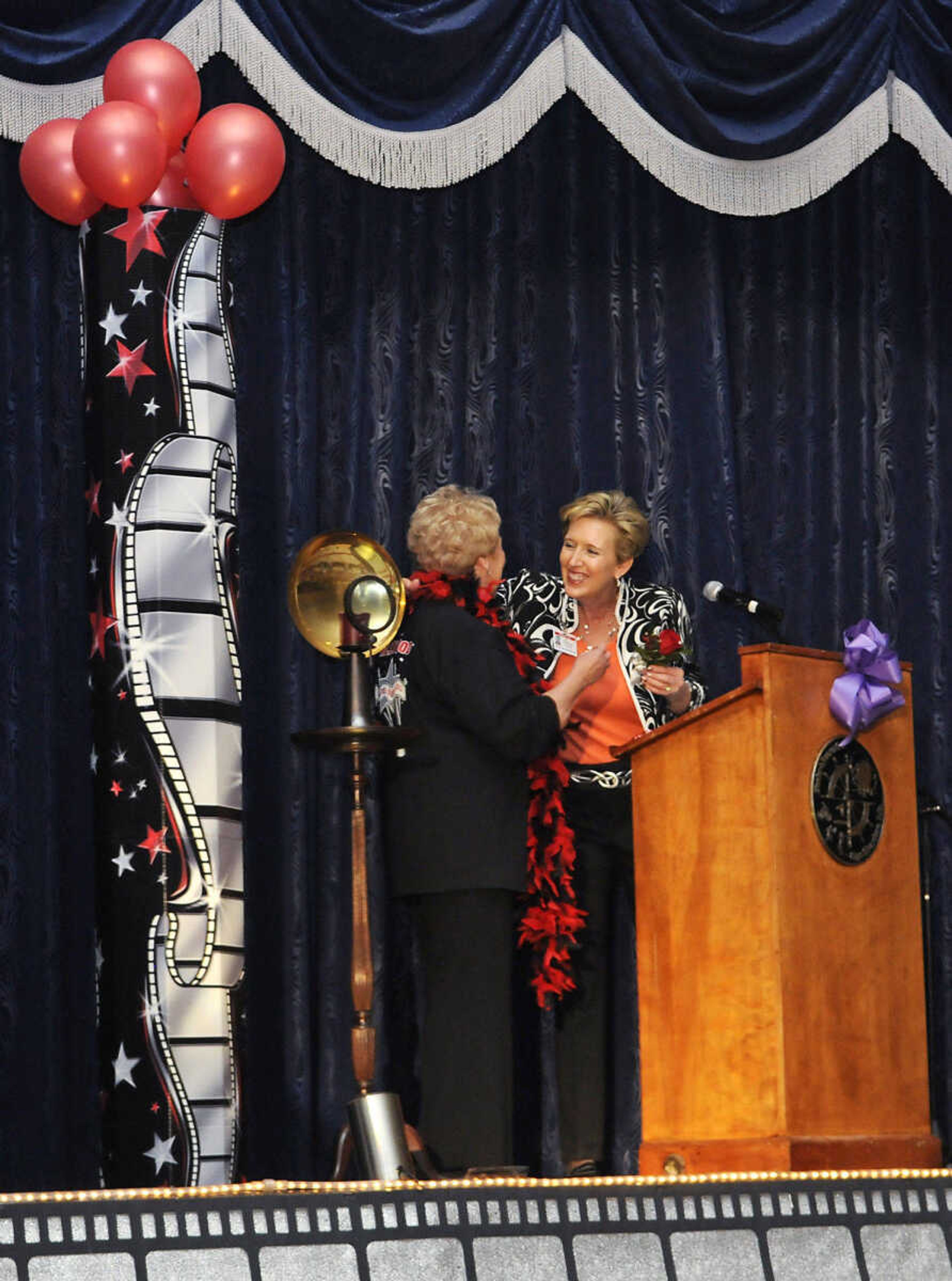 KRISTIN EBERTS ~ keberts@semissourian.com

Debbie Linnes, President and CEO of Southeast Missouri Hospital, right, recognizes Vice President and Chief Nursing Officer of Southeast Missouri Hospital Karen Hendrickson, left, during the 2010 Celebration of Nursing at A.C. Brase Arena in Cape Girardeau, Mo., on Wednesday, May 5. Over 400 area nurses attended the celebration. The night's theme was "Hollywood Salutes Nursing."