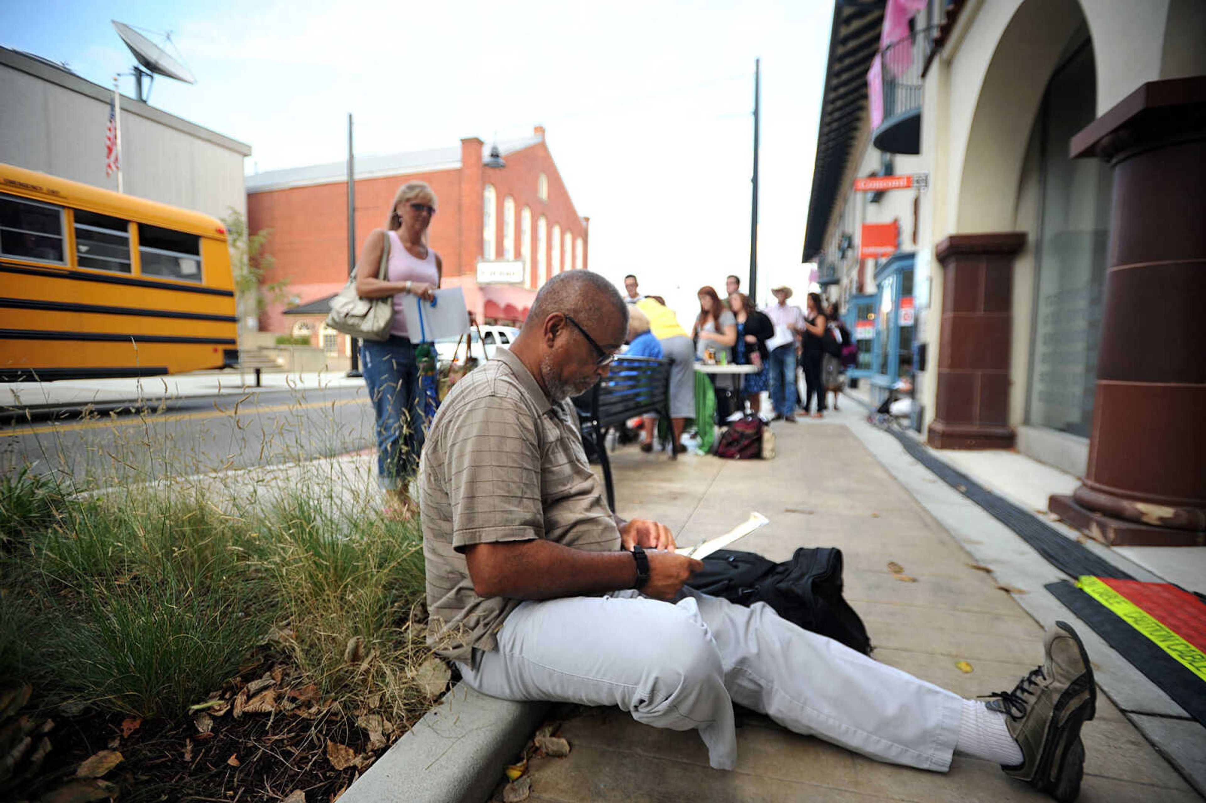 LAURA SIMON ~ lsimon@semissourian.com

Lonnie Williford fills out his paperwork to be an extra in 20th Century Fox's feature film "Gone Girl", Thursday, Oct. 3, 2013, in Cape Girardeau.