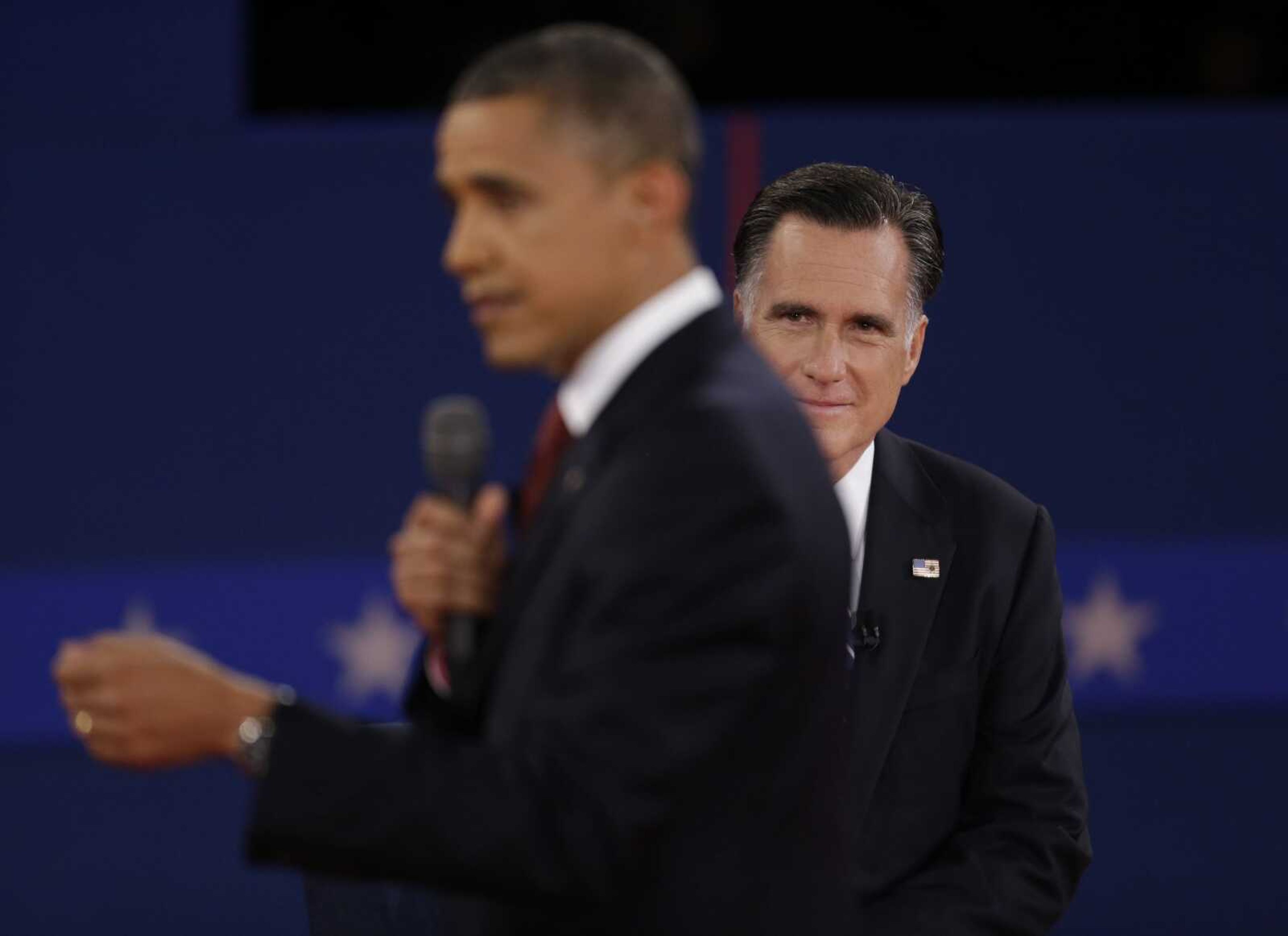 Republican presidential nominee Mitt Romney listens as President Barack Obama speaks during the second presidential debate at Hofstra University, Tuesday, Oct. 16, 2012, in Hempstead, N.Y. (AP Photo/David Goldman)