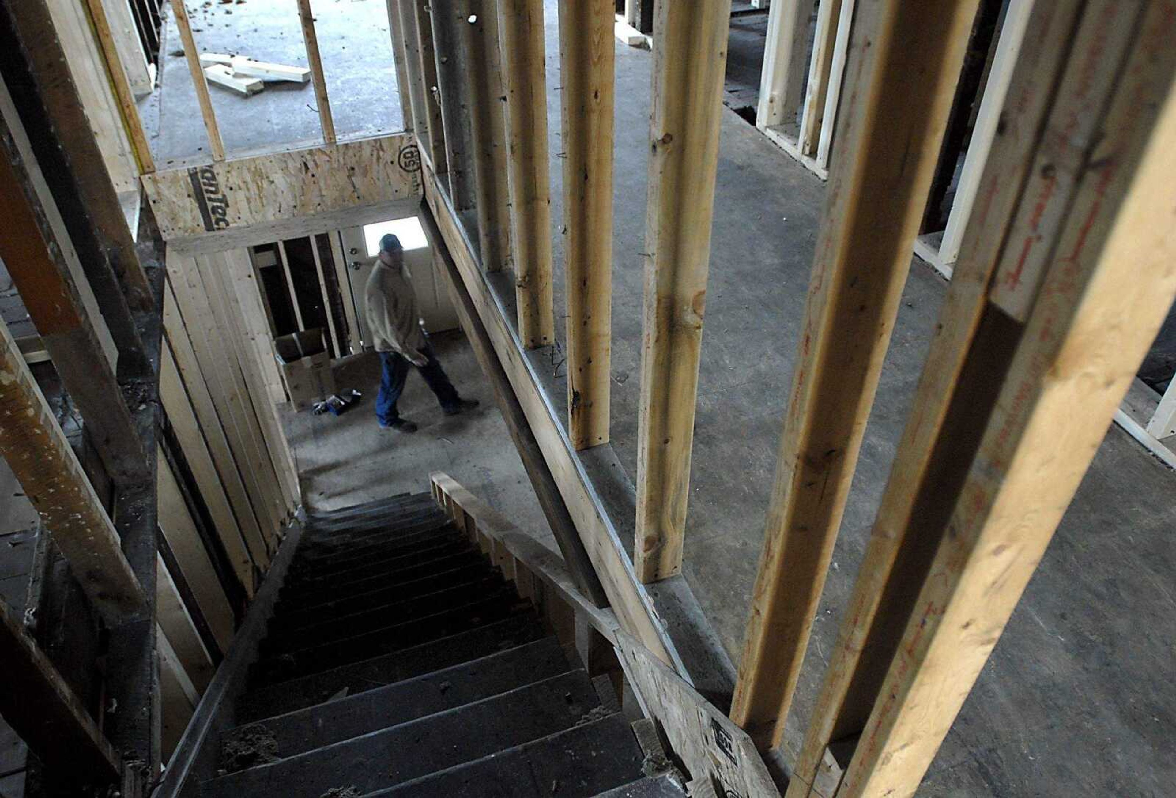 KIT DOYLE ~ kdoyle@semissourian.com
Dustin Richardson, of Centurion Development, walks through a home he is rehabbing Tuesday afternoon, March 3, 2009, on South Middle St. in Cape Girardeau. The home was burned out several years ago and needly to be almost completely reinforced structurally.