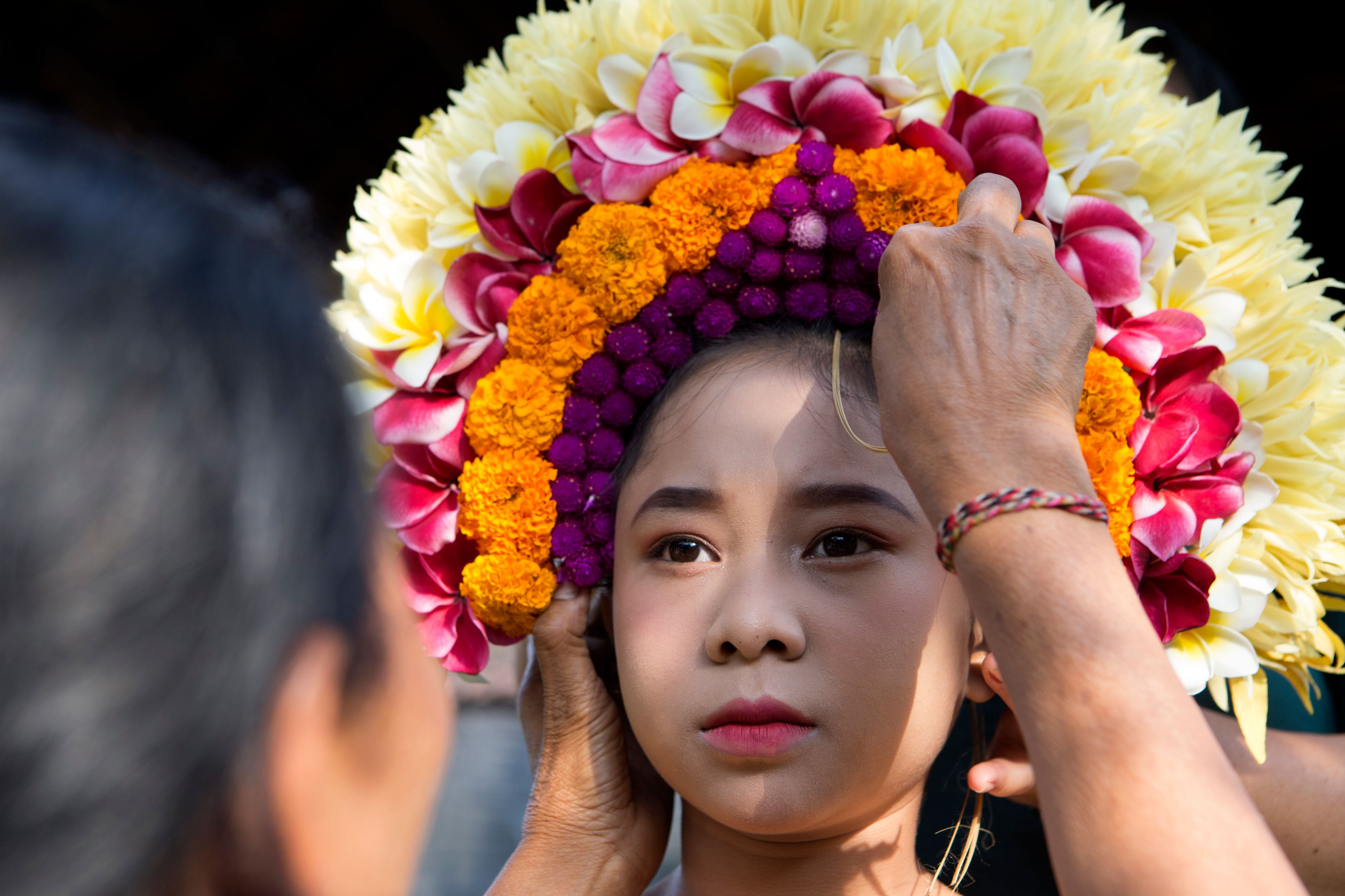 Ketut Nita Wahyuni is dressed up to participate in Rejang Pucuk Hindu ritual ceremony at Geriana Kauh village, Karangasem, Bali, Indonesia, Thursday, Nov. 21, 2024. (AP Photo/Firdia Lisnawati)