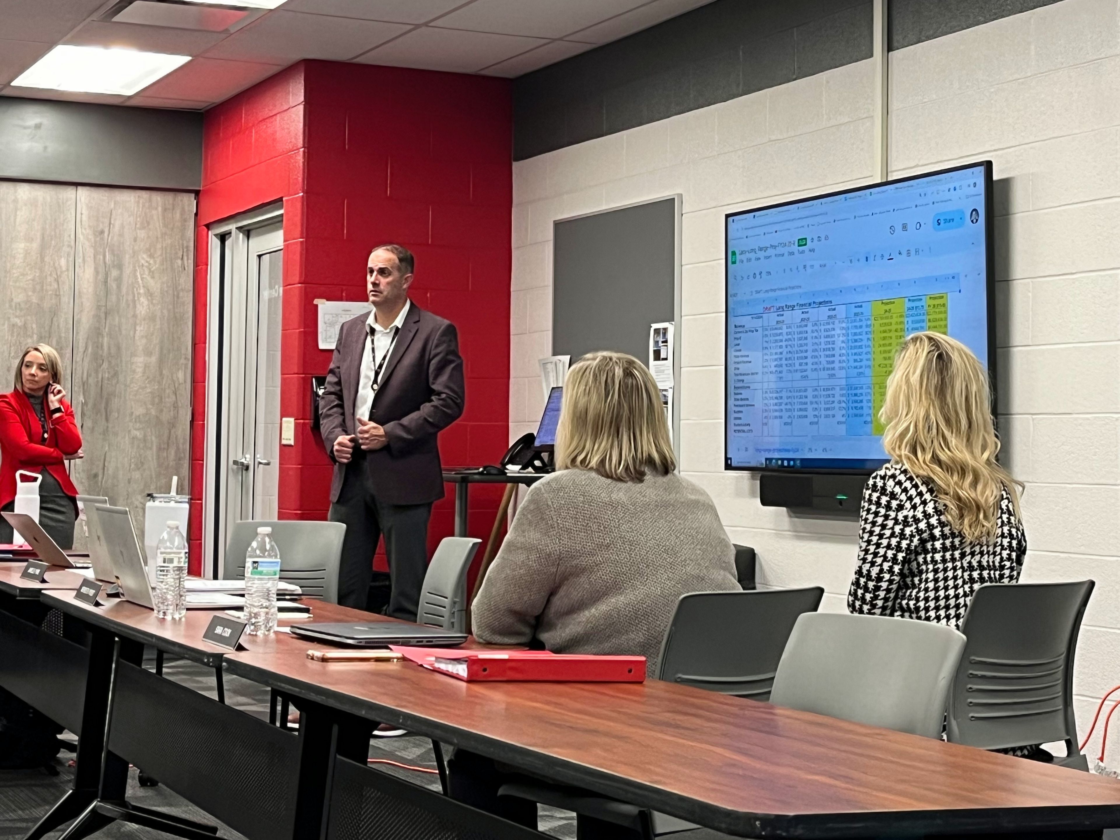 Jackson R-2 Public Schools deputy superintendent of finance Matt Lacy presents at the Thursday, Nov. 14, Board of Education meeting at Jackson High School.