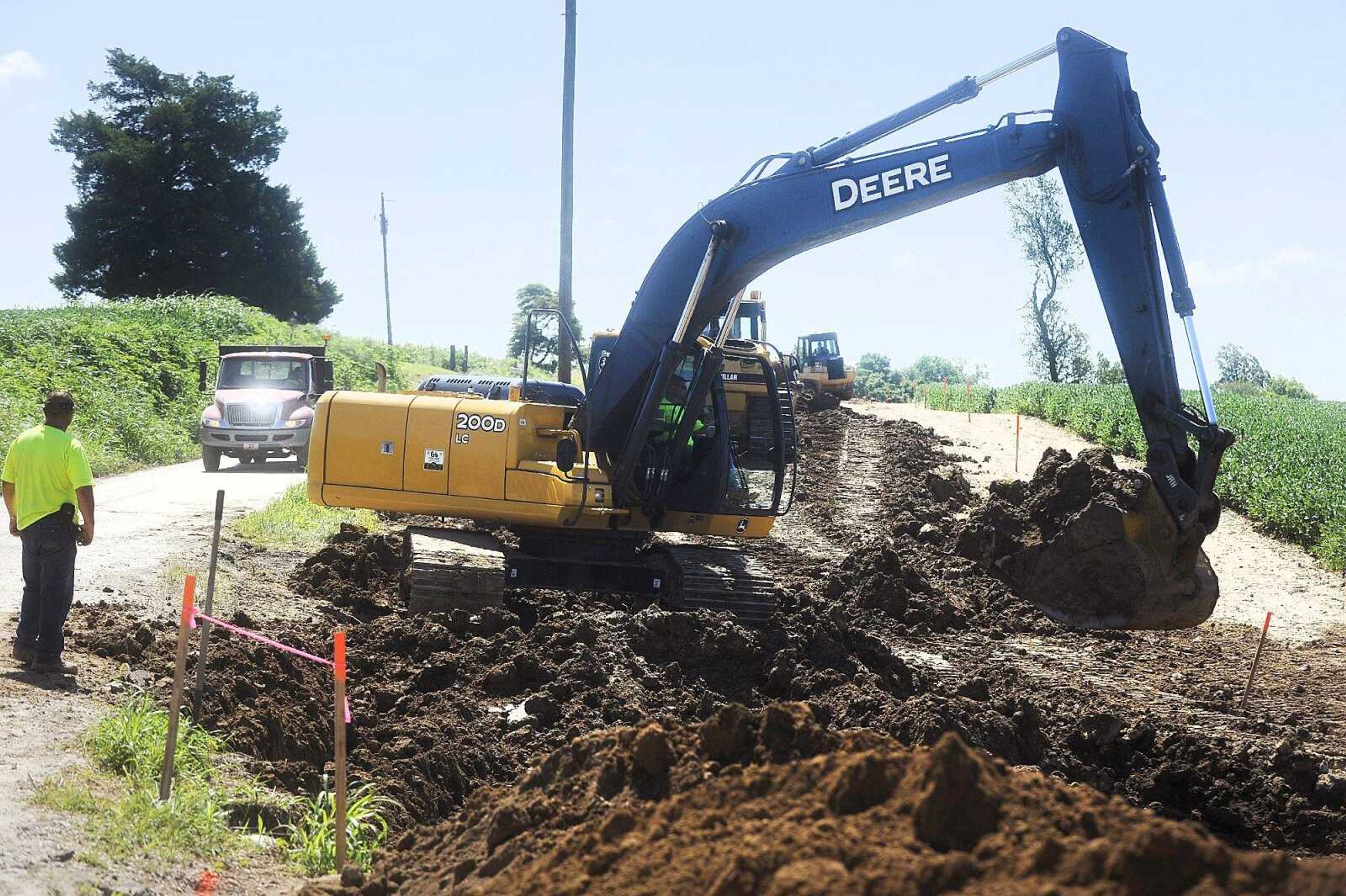 Members of the Cape Girardeau County Highway Department work Wednesday on a part of County Road 346 near Millersville. (Laura Simon)