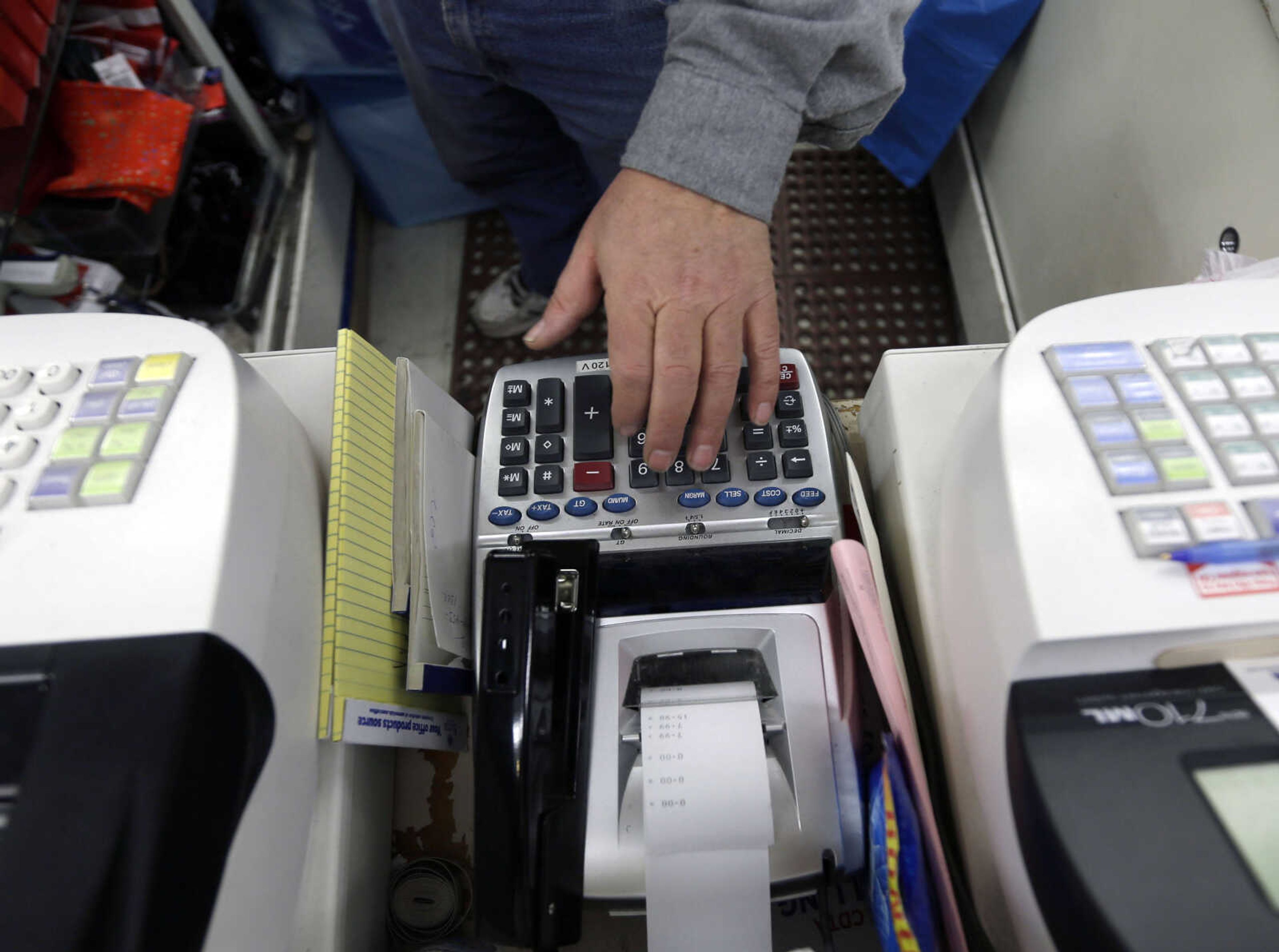 In this Monday, Feb. 25, 2013 file photo, Jack Yonally rings out a customer at Lodge's store in Albany, N.Y. The Commerce Department issues its first estimate of how fast the U.S. economy grew in the January-March quarter on Friday, April 26, 2013. (AP Photo/David Duprey)