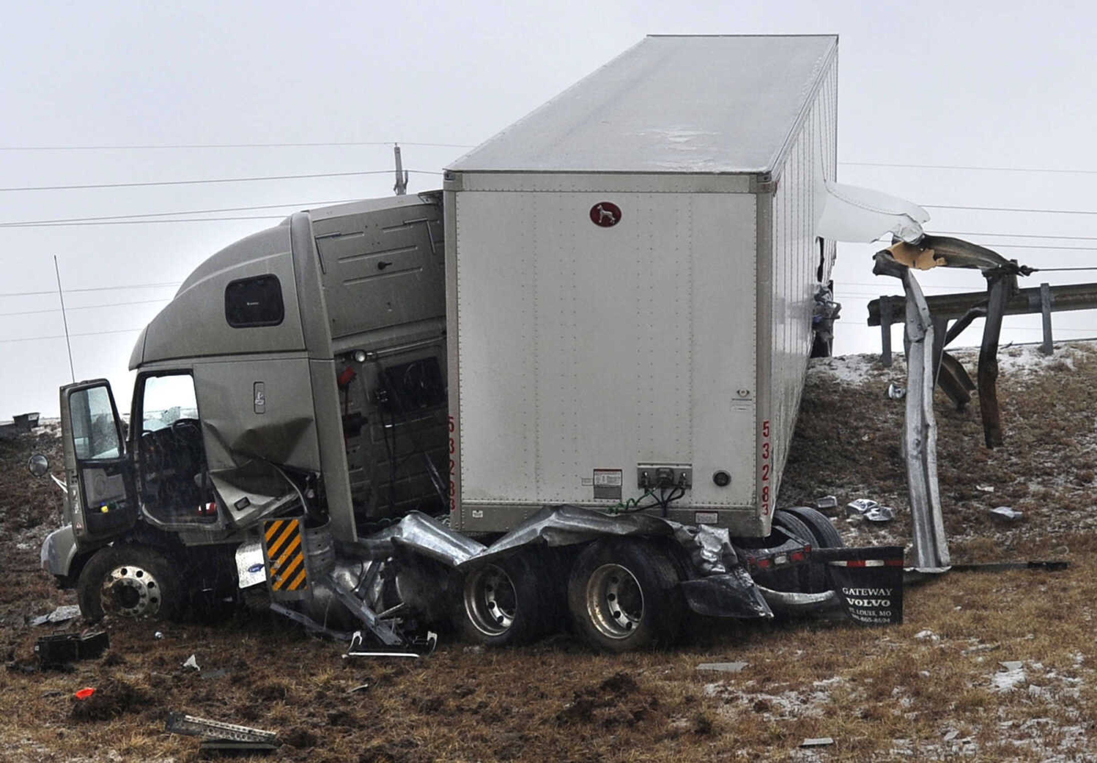 FRED LYNCH ~ flynch@semissourian.com
A section of guard rail is pulled away by a wrecker from a tractor-trailer that slid off the southbound lanes of Interstate 55 on Tuesday, Feb. 4, 2014 at Center Junction north of Cape Girardeau.