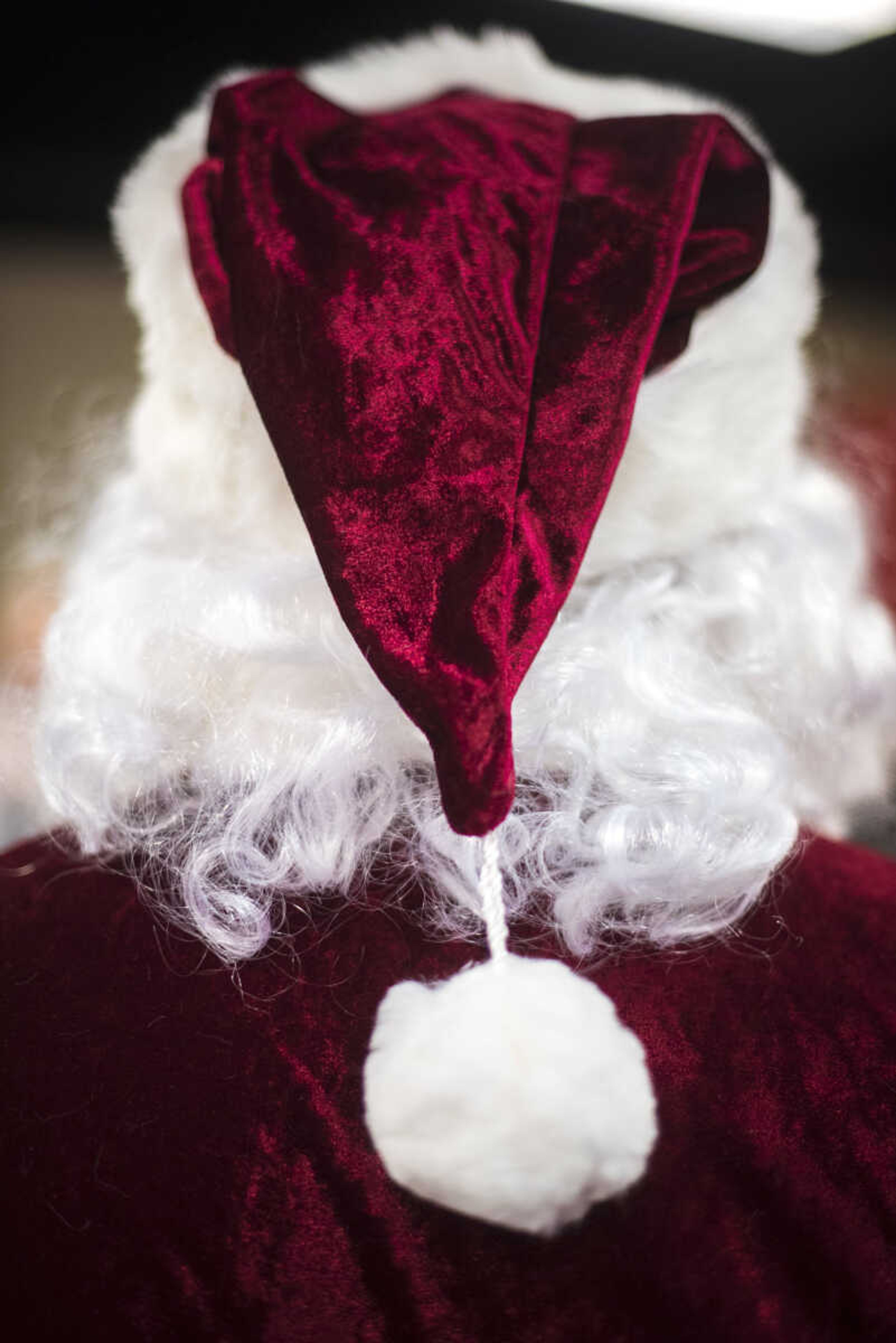 A Santa in his full suit listens during the Jaycee Toybox delivery on Thursday, Dec. 21, 2017, in Cape Girardeau.