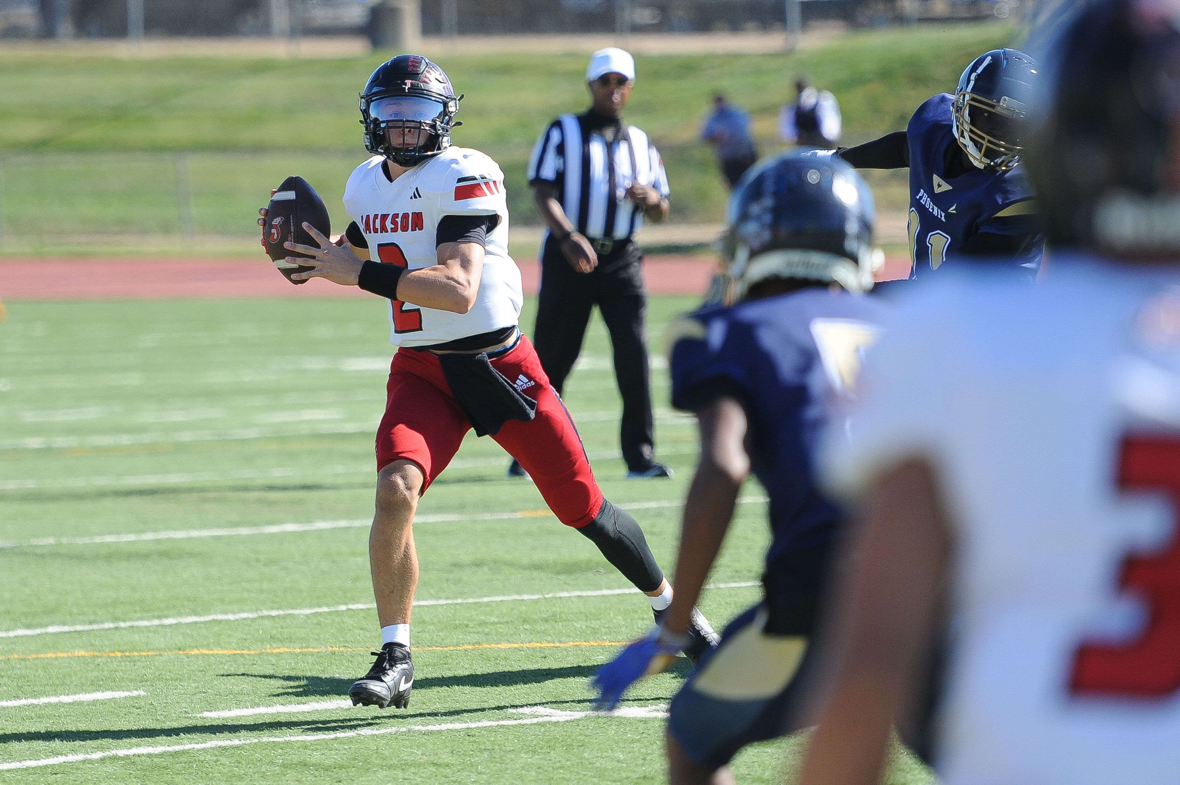 Jackson's Drew Parsons surveys downfield during a Saturday, October 19, 2024 game between the Miller Career/Vashon Phoenix and the Jackson Indians at Gateway STEM High School in St. Louis. Jackson defeated Miller Career, 55-14.