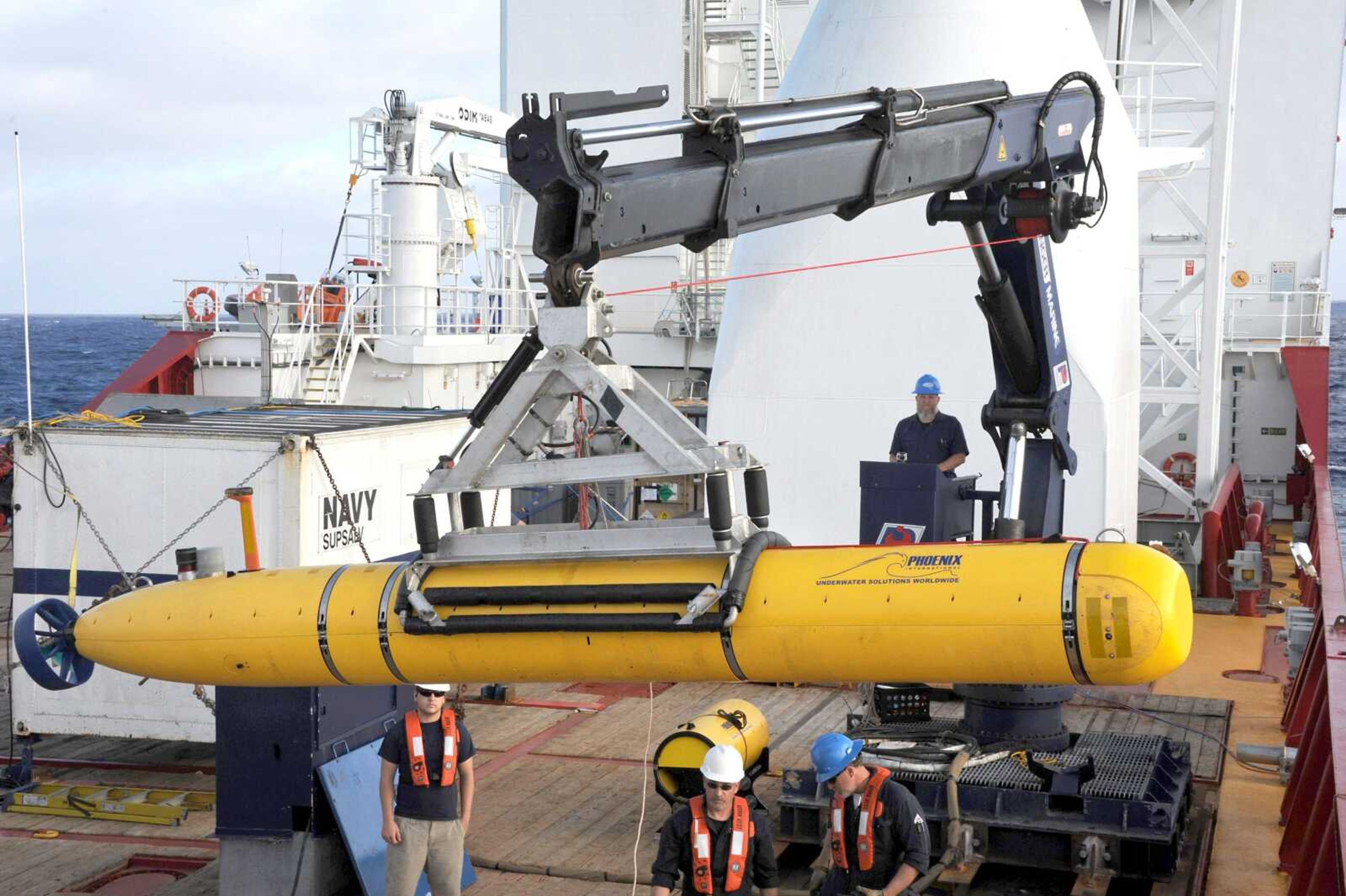 Operators aboard the Australian defense vessel Ocean Shield move the U.S. Navy&#8217;s Bluefin-21 autonomous underwater vehicle into position for deployment Monday to search for the missing Malaysia Airlines Flight 370. On Tuesday the U.S. Navy and search coordinators said that a built-in safety feature aborted what was supposed to have been a 16-hour mission to create a sonar map of the ocean floor after only six hours. (MC1 Peter D. Blair ~ U.S. Navy)