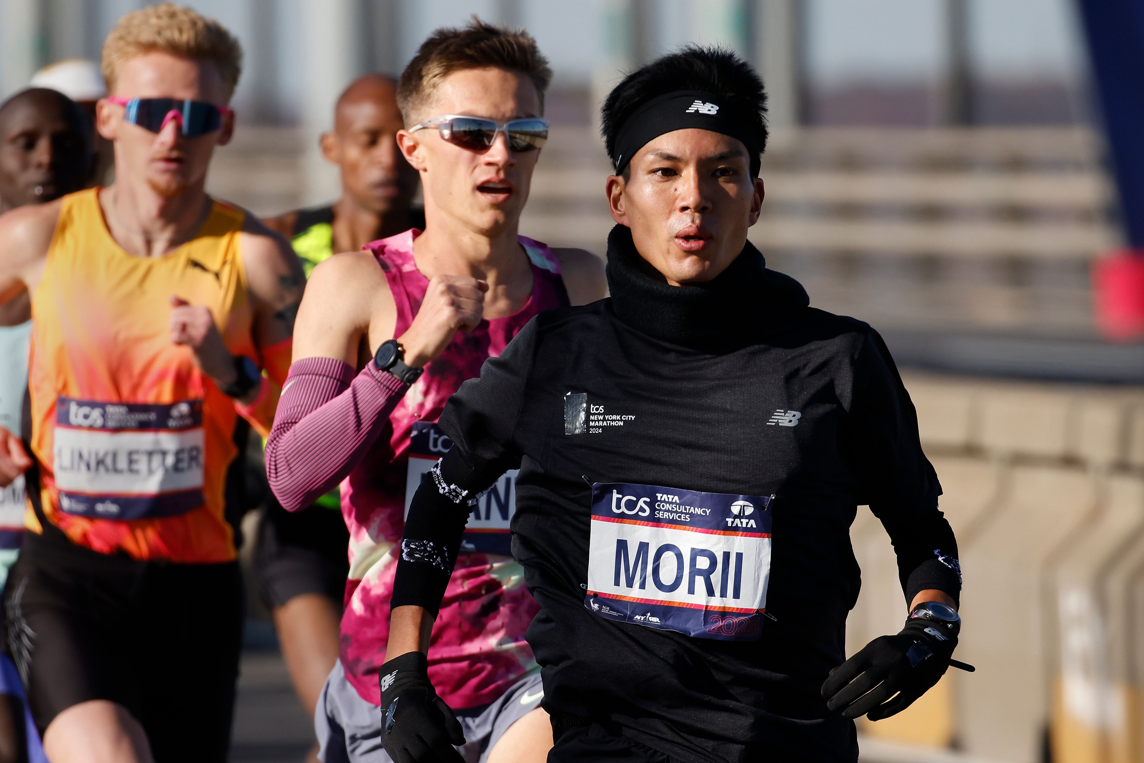 Yuma Morii, of Japan, right, makes his way across the Verrazzano Narrows bridge with the elite men's division runners during the New York City Marathon, Sunday, Nov. 3, 2024, in New York.(AP Photo/Eduardo Munoz Alvarez)