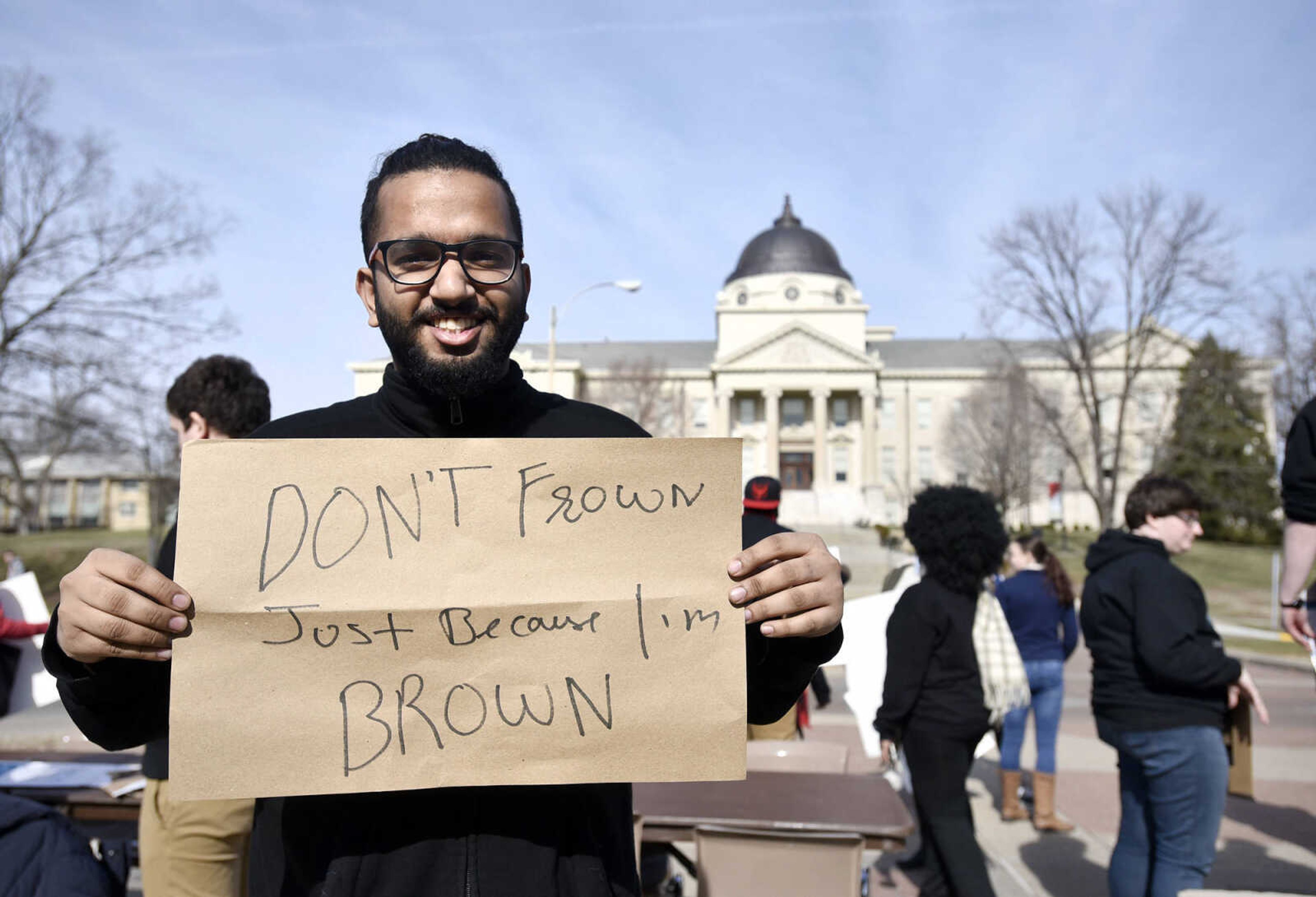 LAURA SIMON ~ lsimon@semissourian.com

Mayank "Cranky" Sood poses for a photo with his sign during a human rights protest on Wednesday, Feb. 1, 2017, outside Southeast Missouri State University's Kent Library in Cape Girardeau. Around 60 students participated in the protest.