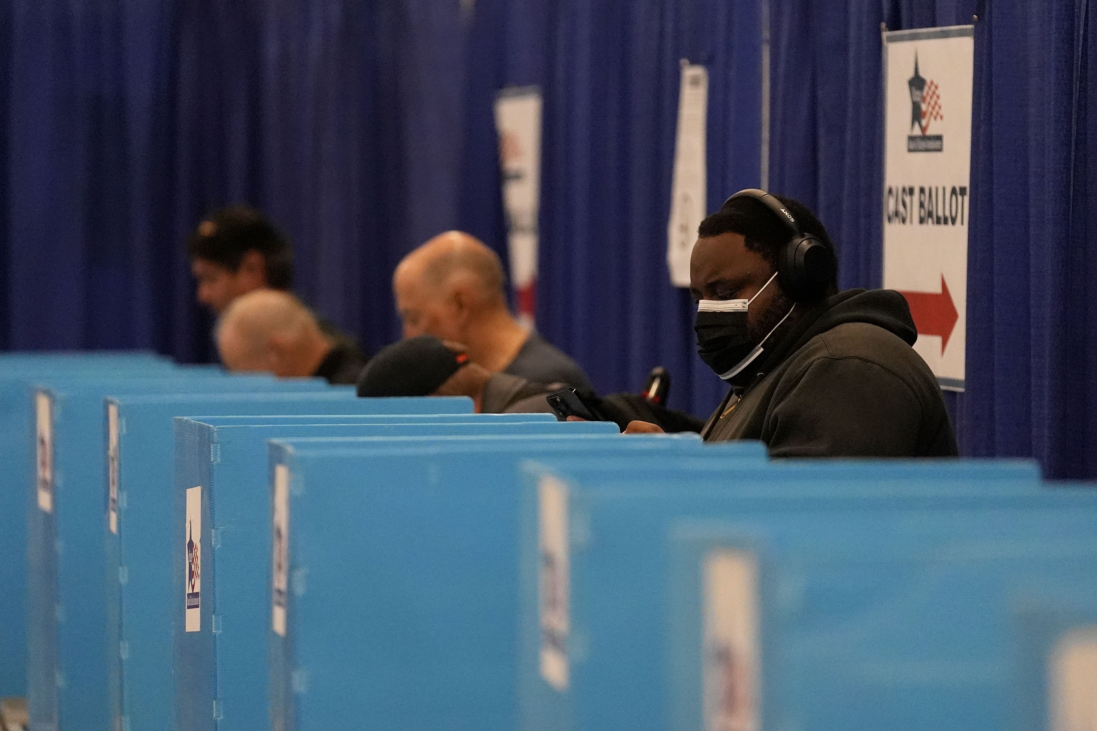 People check in on the first day of early voting for the 2024 Presidential General Election, Thursday, Oct. 3, 2024 in Chicago. (AP Photo/Charles Rex Arbogast)