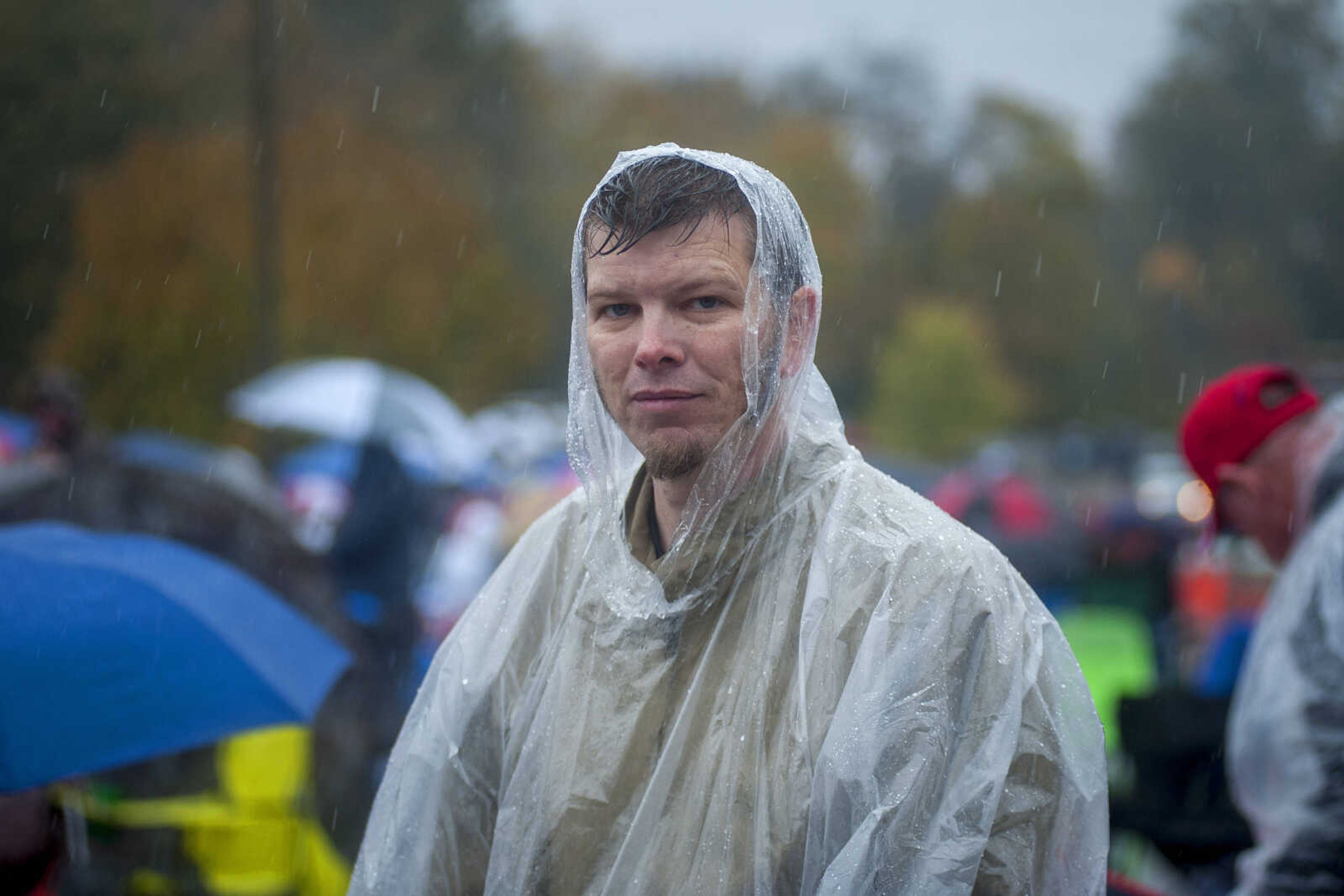 Christopher Lowe, 42, poses for a portrait in the rain outside of the Show Me Center Monday, Nov. 5, 2018, in Cape Girardeau. "It's a once-in-a-lifetime opportunity to meet the President of the United States," Lowe said. "He's the only President I've fully supported since I've been alive."