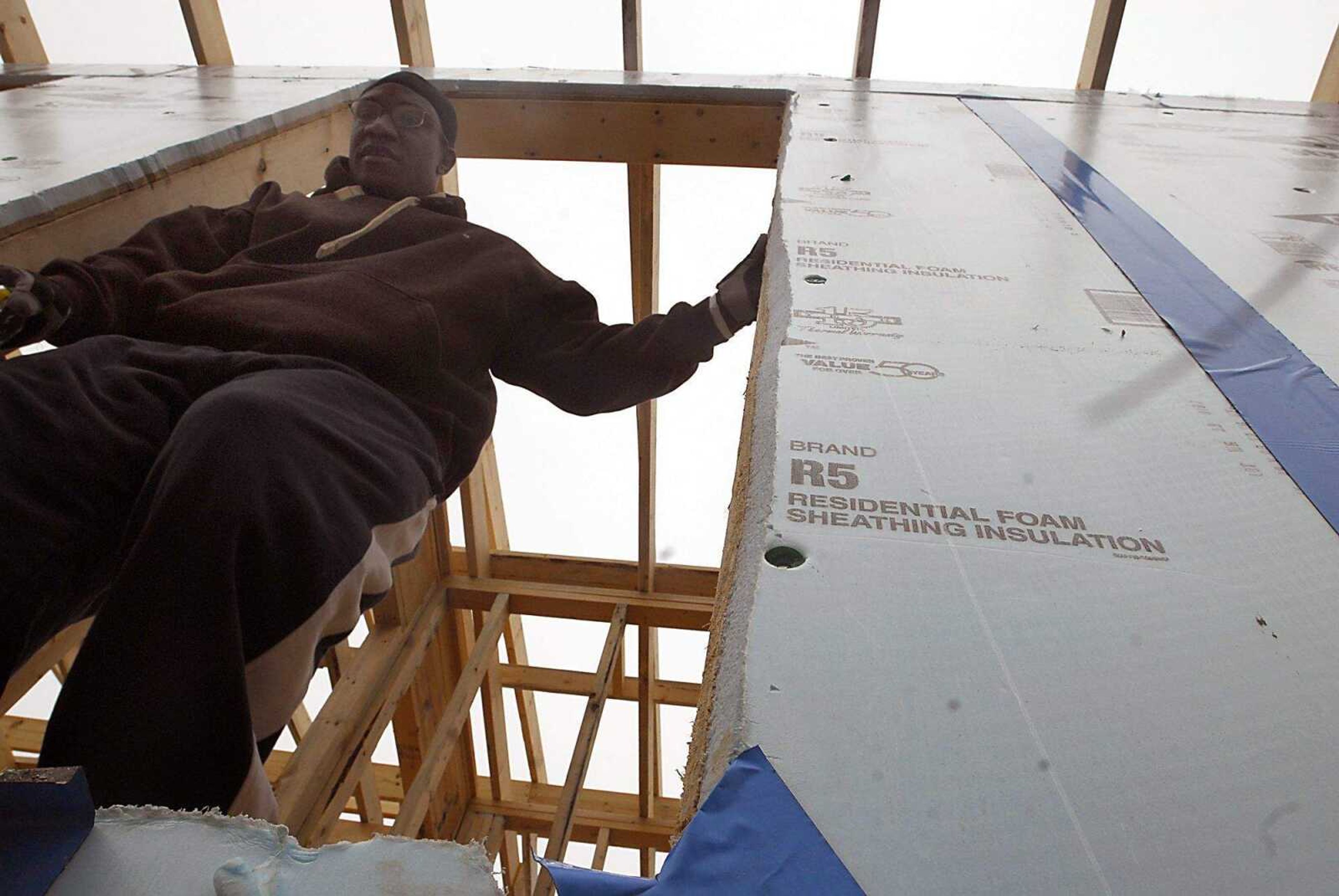 KIT DOYLE ~ kdoyle@semissourian.com
John Sterling exits his future home, being built by Habitat for Humanity, Thursday morning, March 12, 2009, in Cape Girardeau.