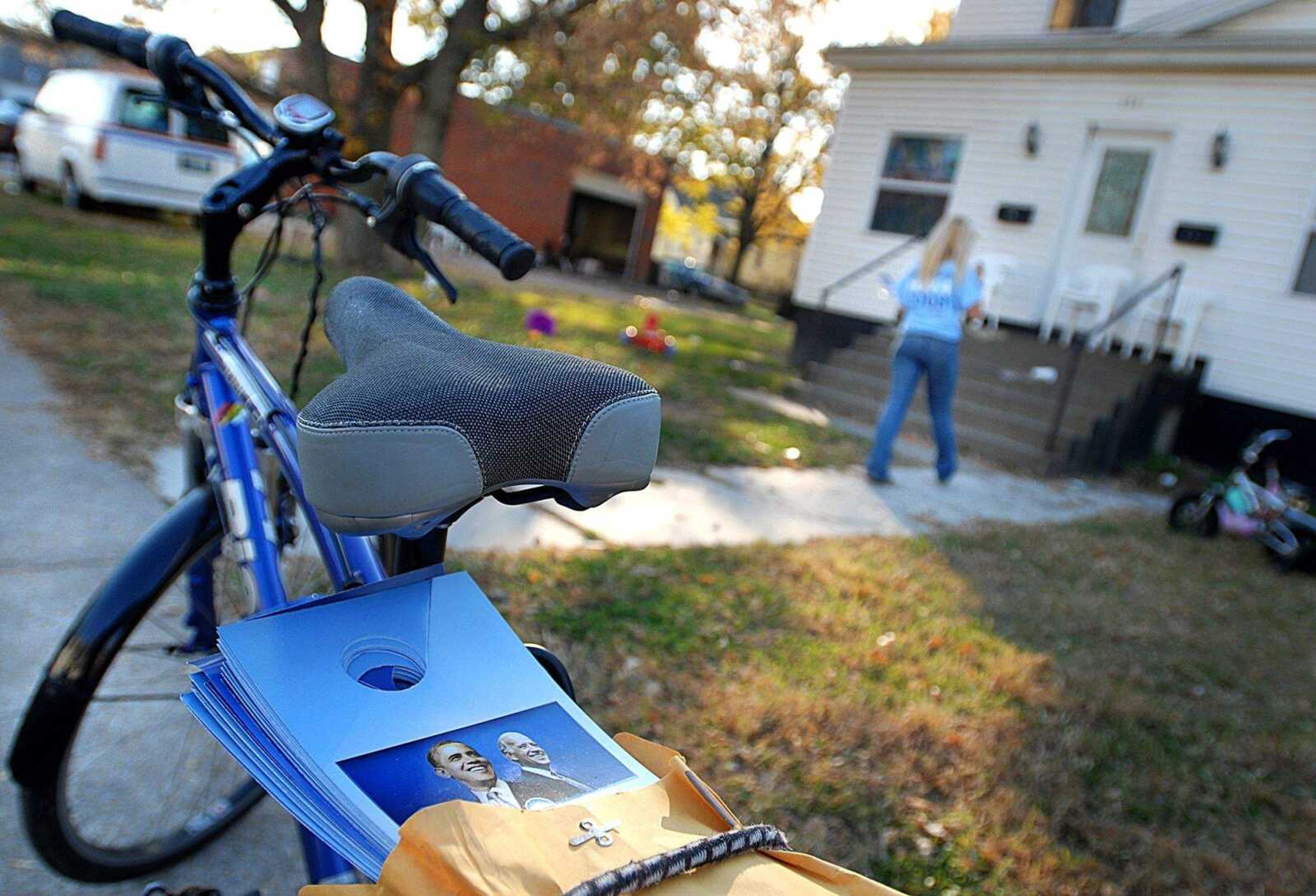 AARON EISENHAUER ~ aeisenhauer@semissourian.com
With plenty of door hangers strapped to her bike, Tammy Nimmer, a volunteer for the Obama campaign, stops at a home on Ellis Street to encourage them to vote on Tuesday, November 4, 2008.