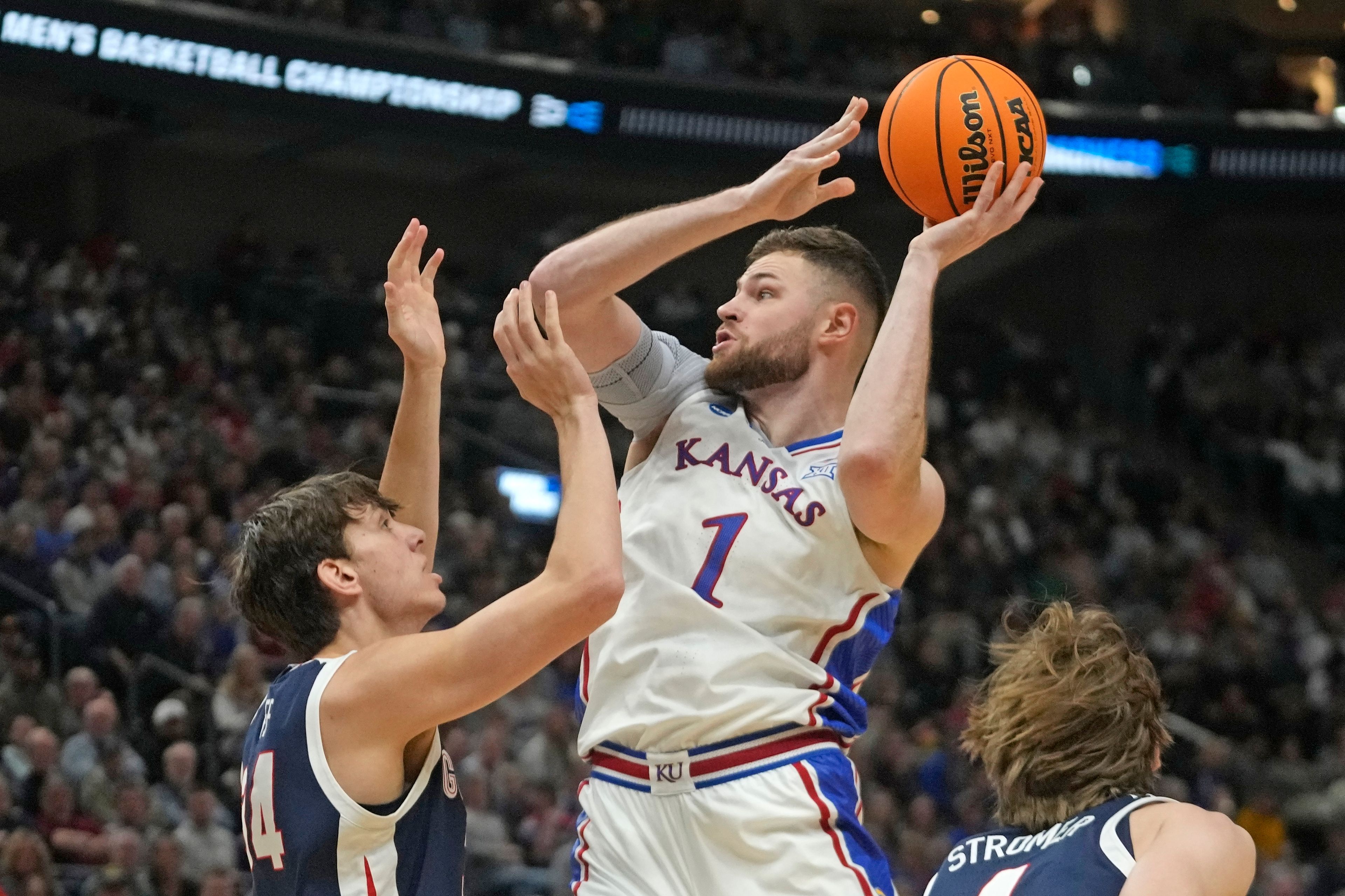 FILE - Kansas center Hunter Dickinson (1) shoots as Gonzaga forward Braden Huff (34) defends during the first half of a second-round college basketball game in the NCAA Tournament in Salt Lake City, Saturday, March 23, 2024. (AP Photo/Rick Bowmer, File)