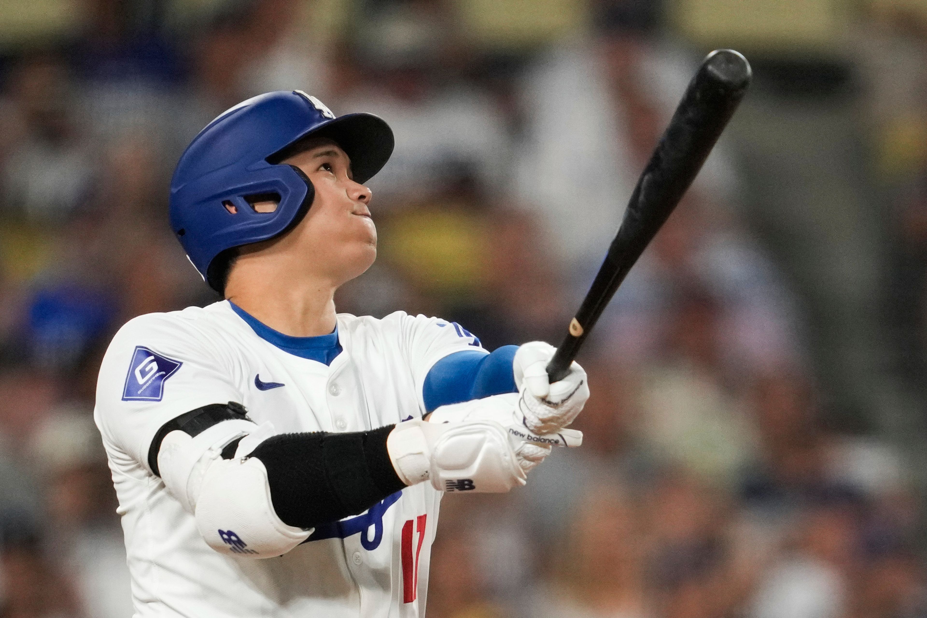 Los Angeles Dodgers designated hitter Shohei Ohtani (17) hits a home run during the sixth inning of a baseball game against the Cleveland Guardians in Los Angeles, Friday, Sept. 6, 2024. (AP Photo/Ashley Landis)