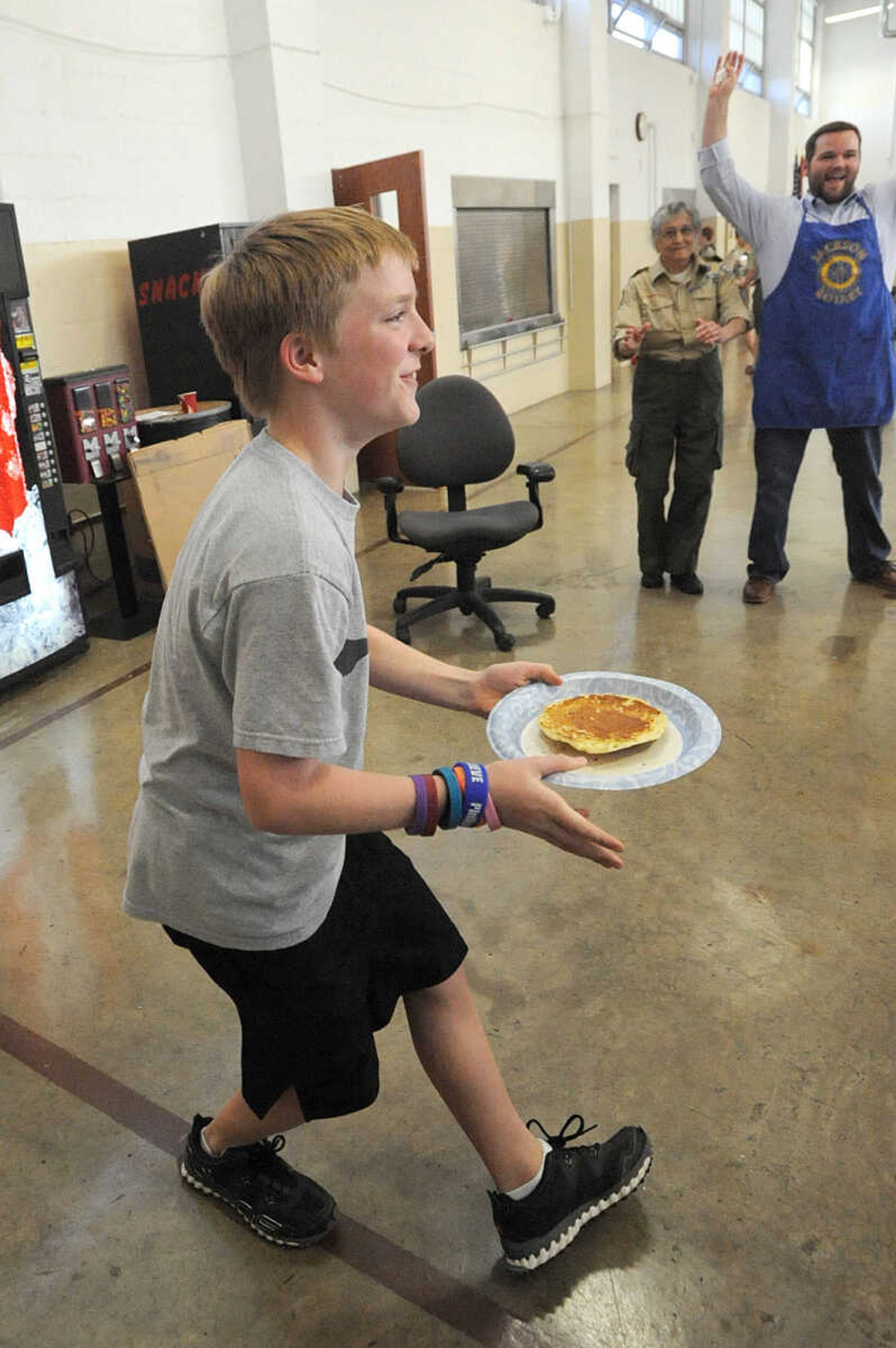 LAURA SIMON ~ lsimon@semissourian.com
Adam Walker catches a pancake hot from the griddle Tuesday, Oct. 23, 2012 during the Jackson Rotary Pancake Day at the National Guard Armory. People could pick from plain, chocolate chip, pecan and blueberry pancakes and a side of sausage.