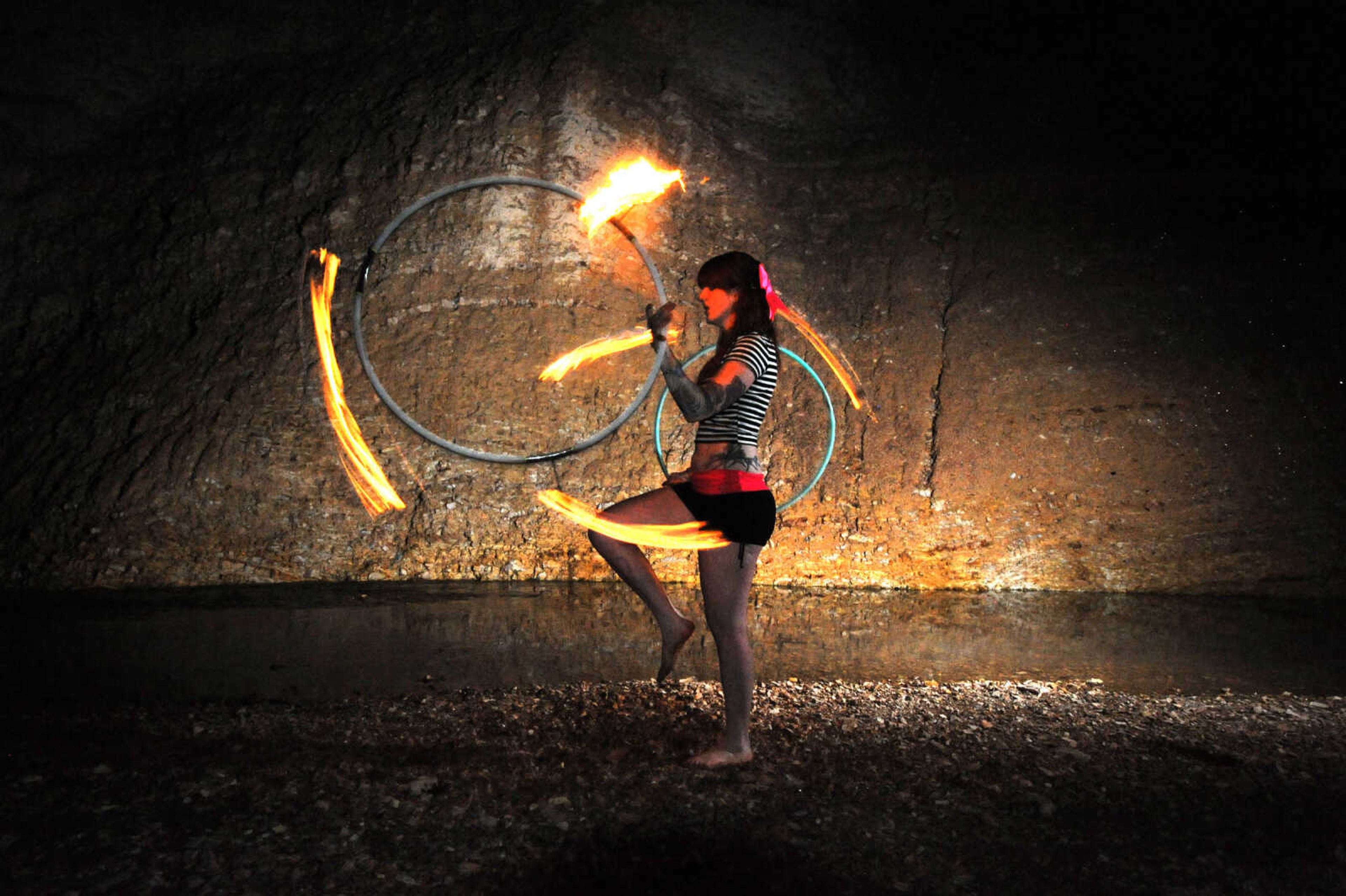 LAURA SIMON ~ lsimon@semissourian.com

Chelsie Welker fire hoops in a Cape Girardeau County creek, Tuesday, May 26, 2015.