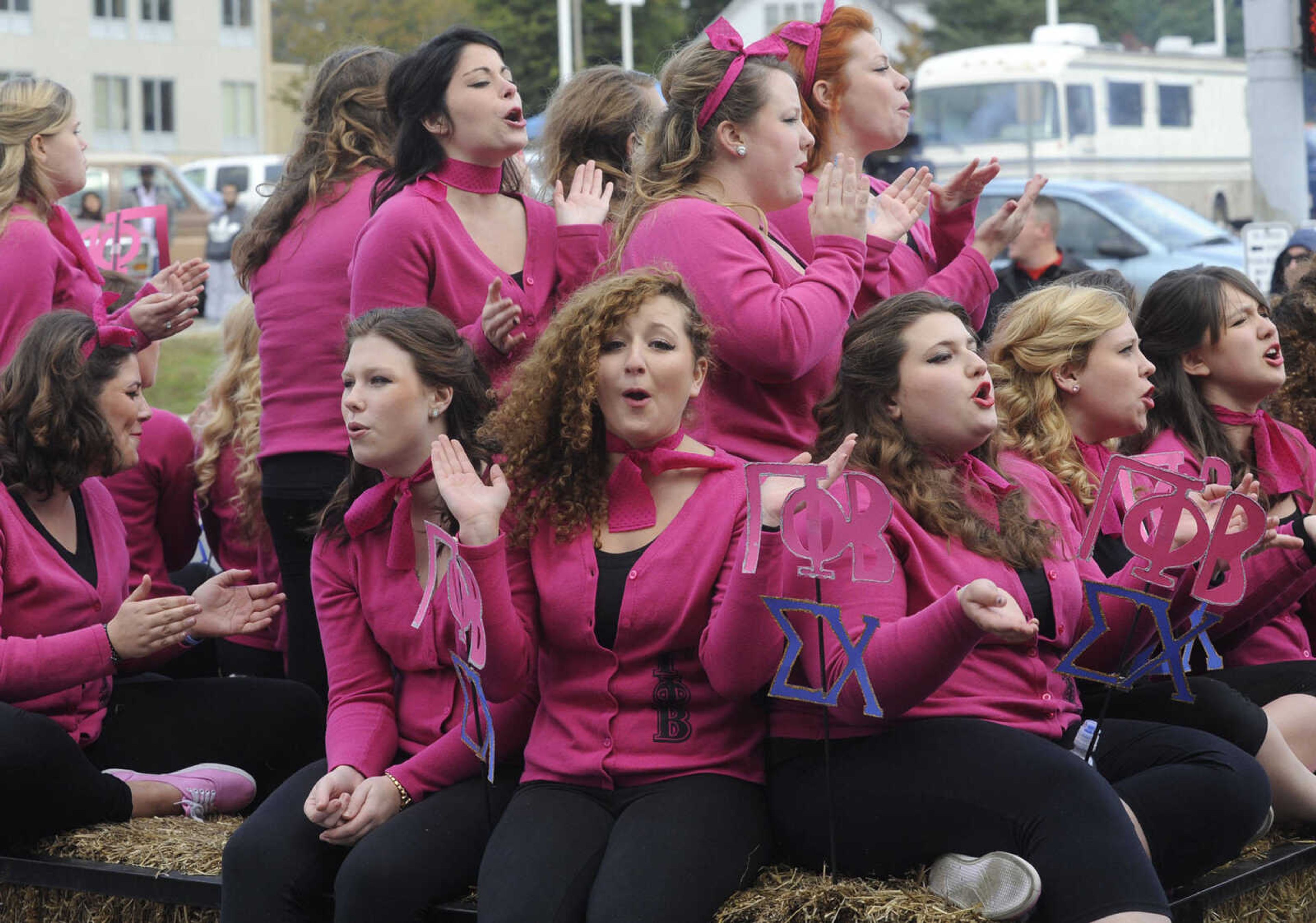 Gamma Phi Beta members ride in the SEMO Homecoming parade Saturday, Oct. 26, 2013 on Broadway in Cape Girardeau.